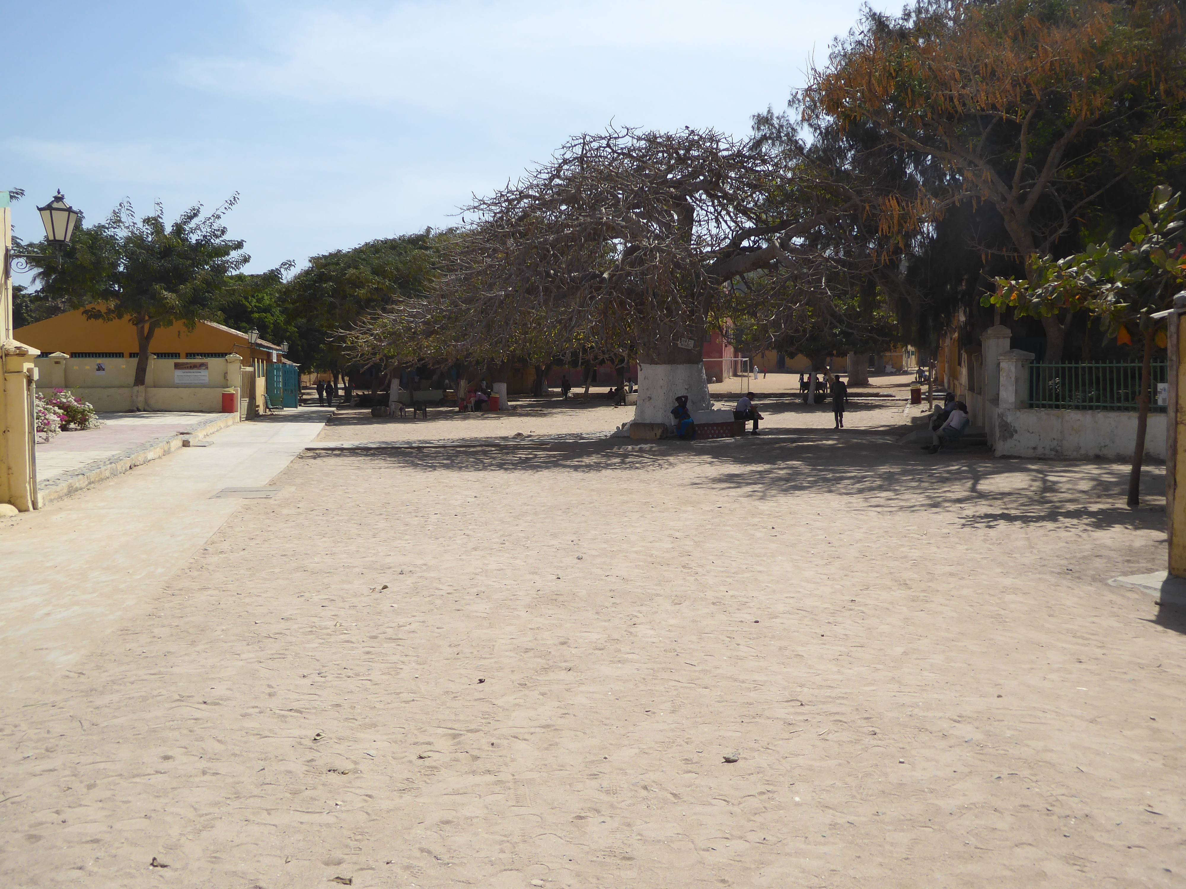 There's a sandy central plaza, decorated with Parisian lamp standards and baobabs.