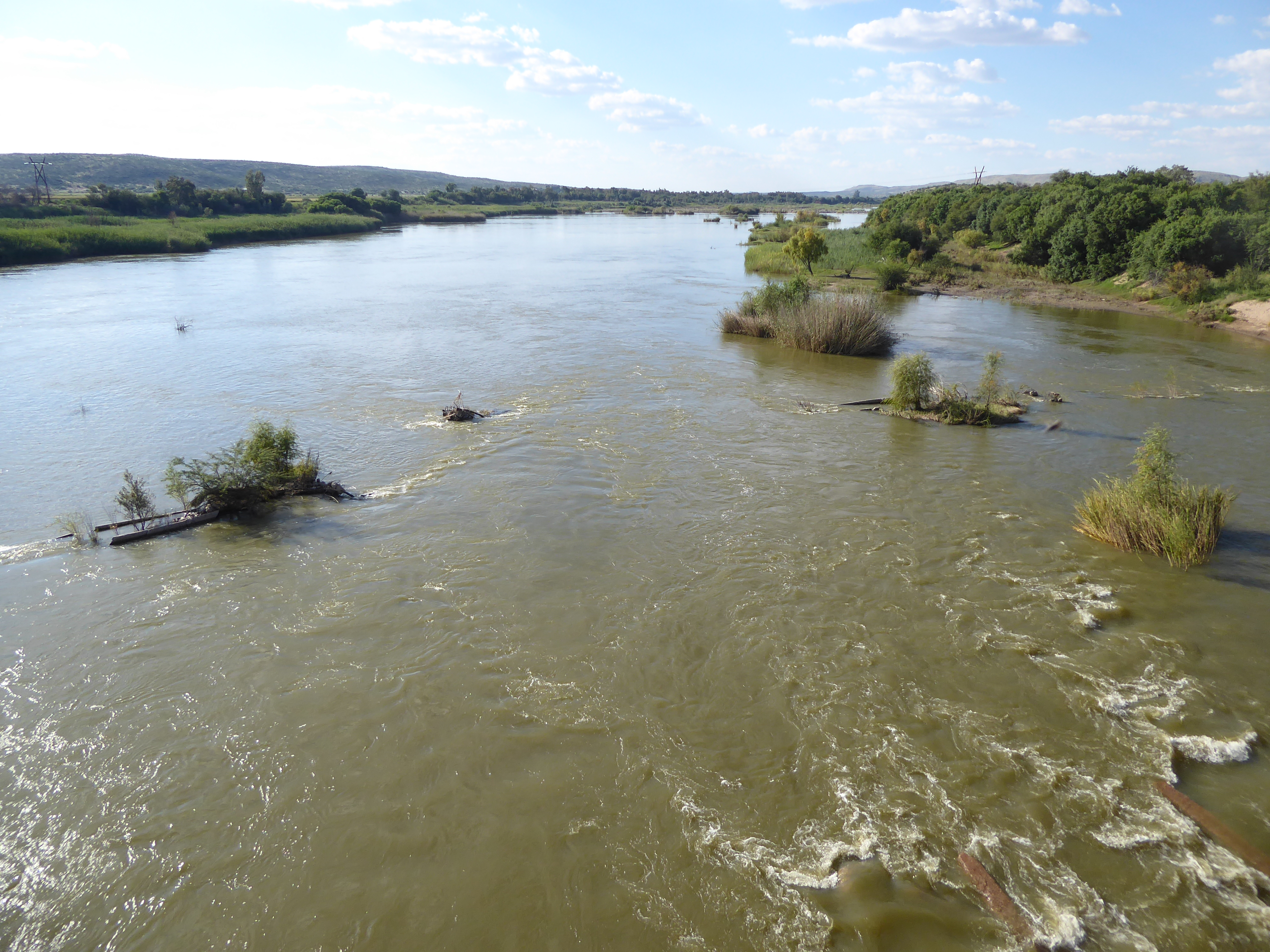Here we meet the Orange River, which has already run 1,400 miles from the Drakensberg in Lesotho. It's another 100 miles, or a bit less, to