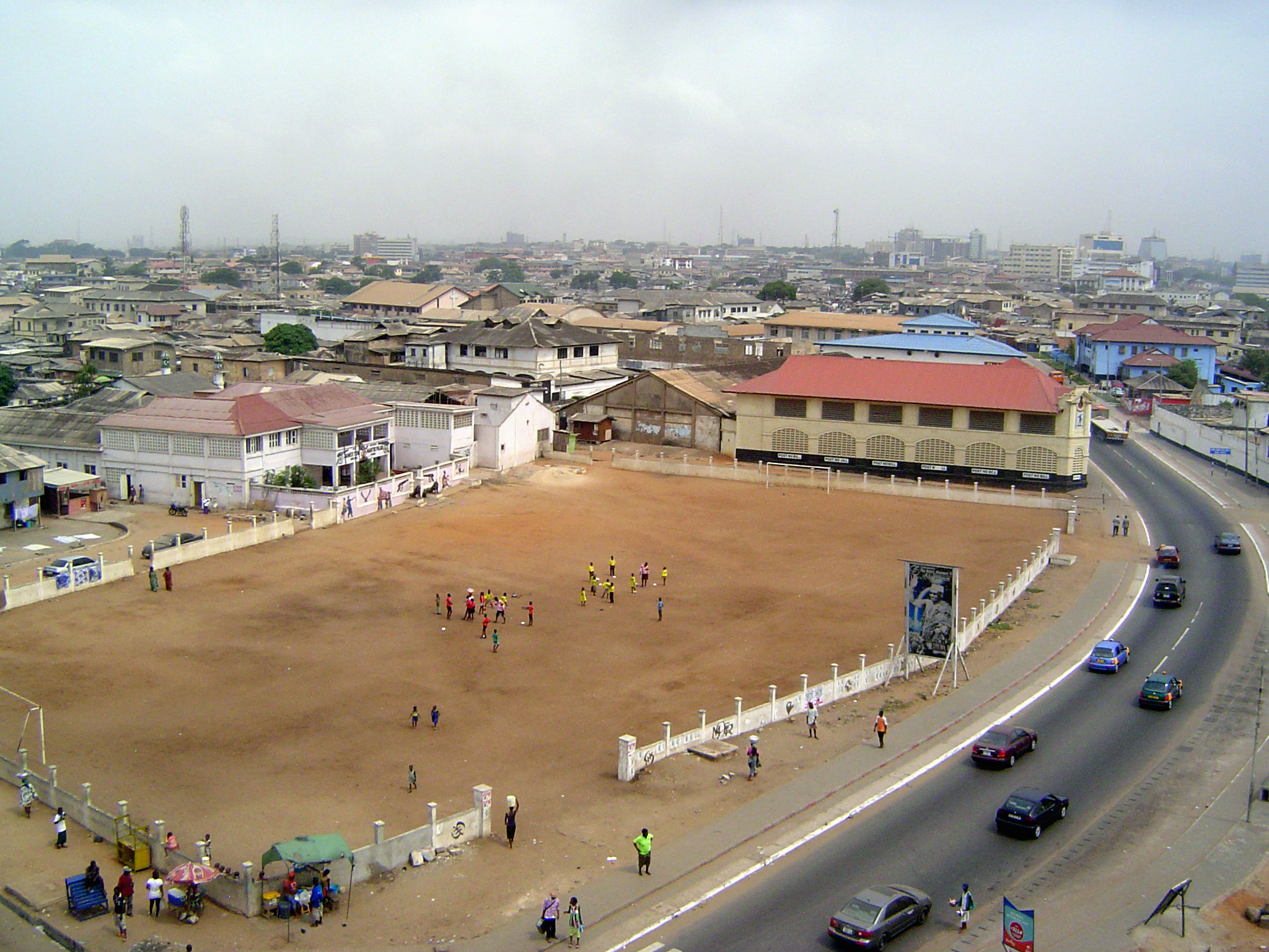 The multi-storied buildings of Accra Central are in the distance.