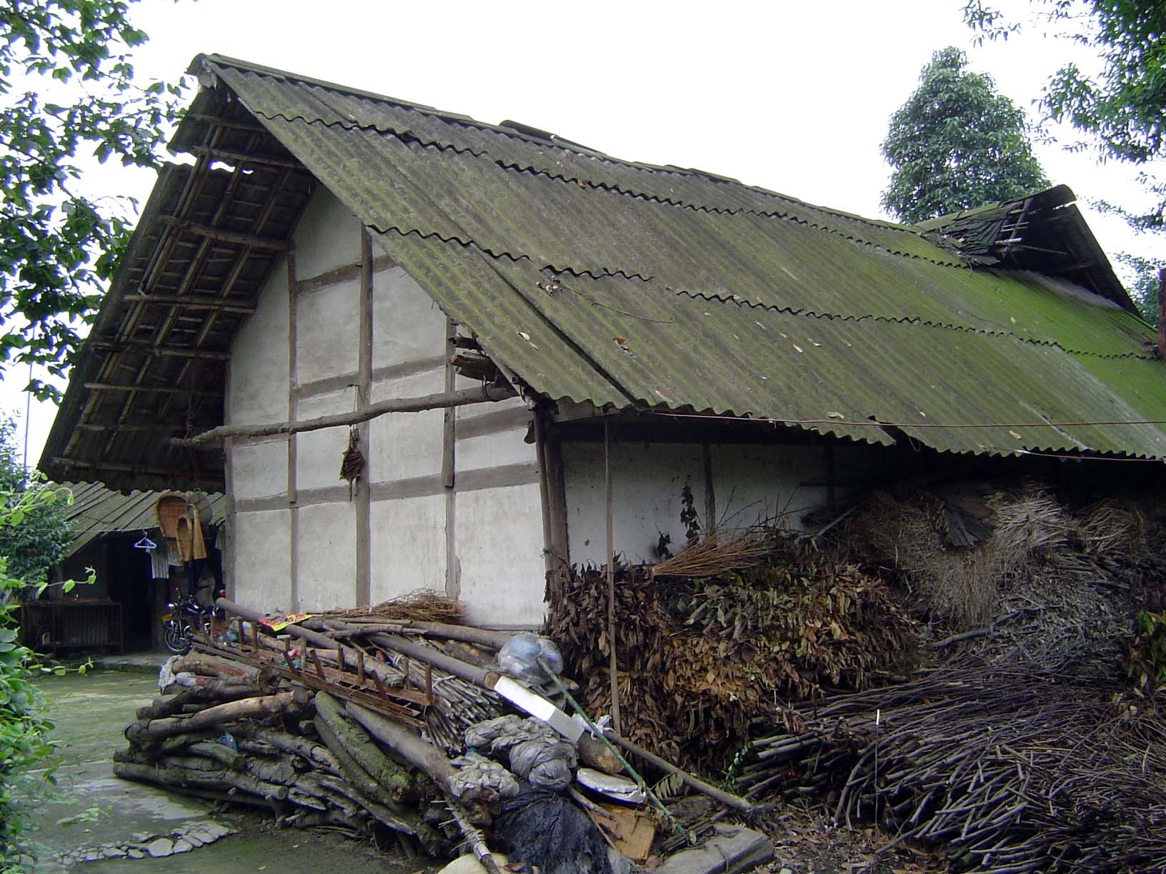 It leads to a farm house, fuelwood stacked all around.