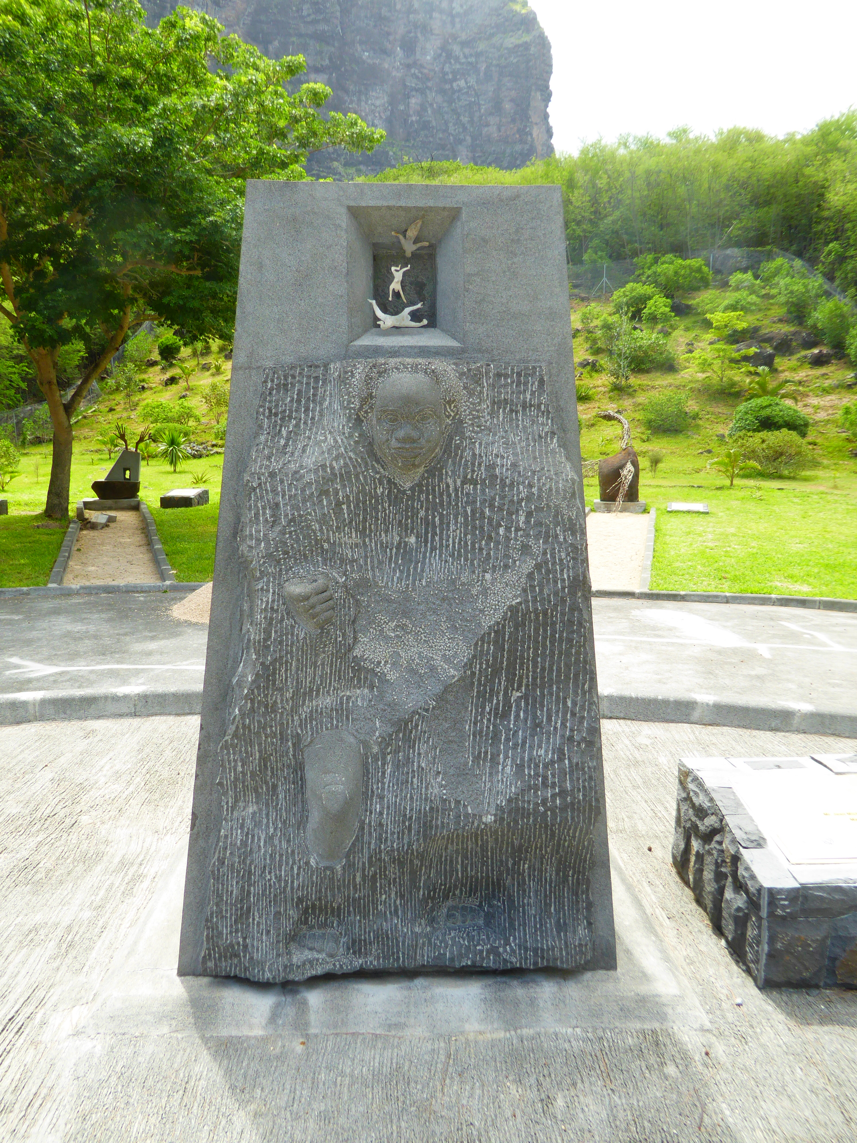 Emerging into freedom? The smaller figures at the top allude to the traditional belief that in 1835 the escaped slaves on the mountain kille