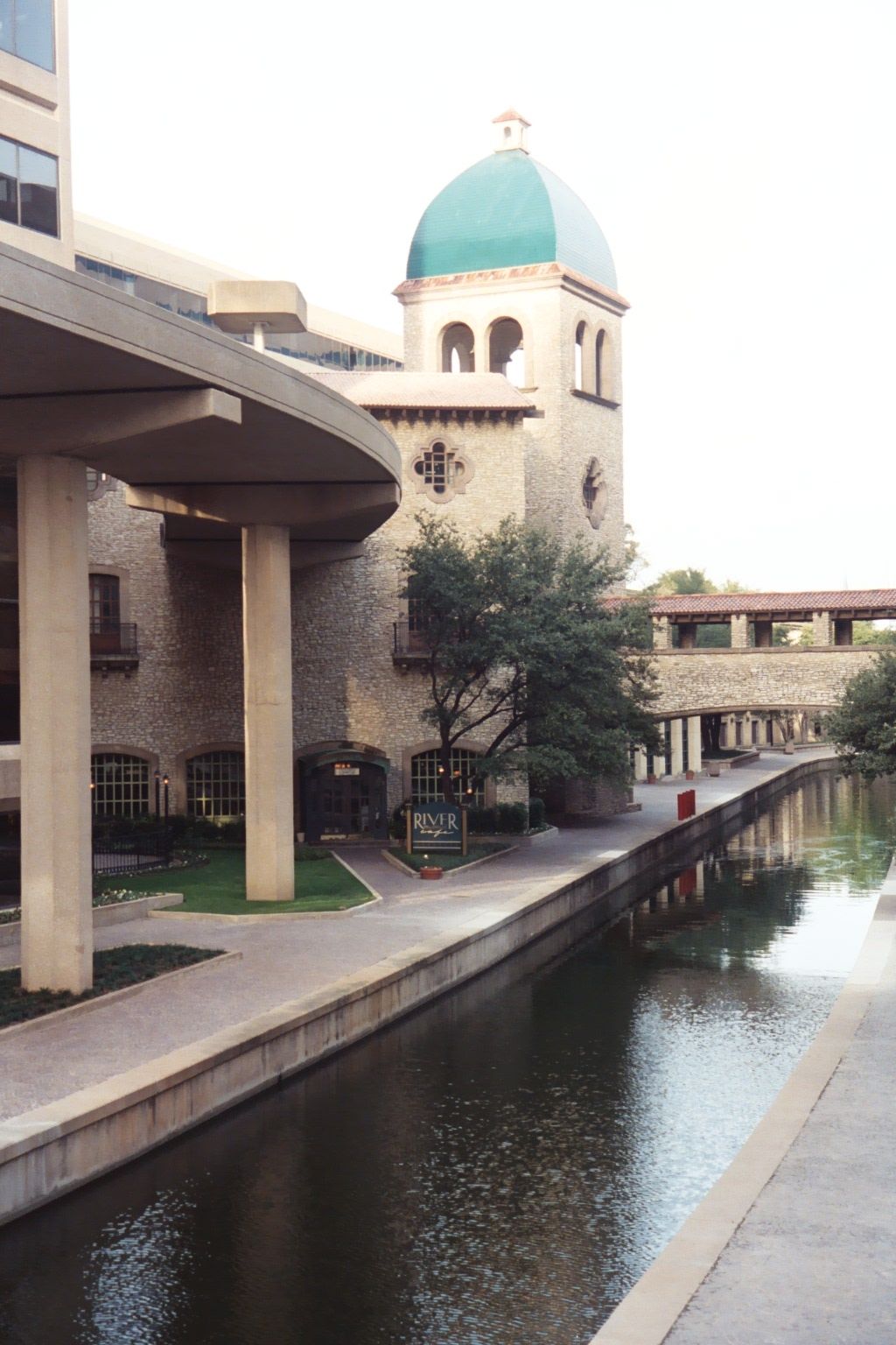 The canal is as straight as an engineer could make it, and the curve above is a garage ramp.