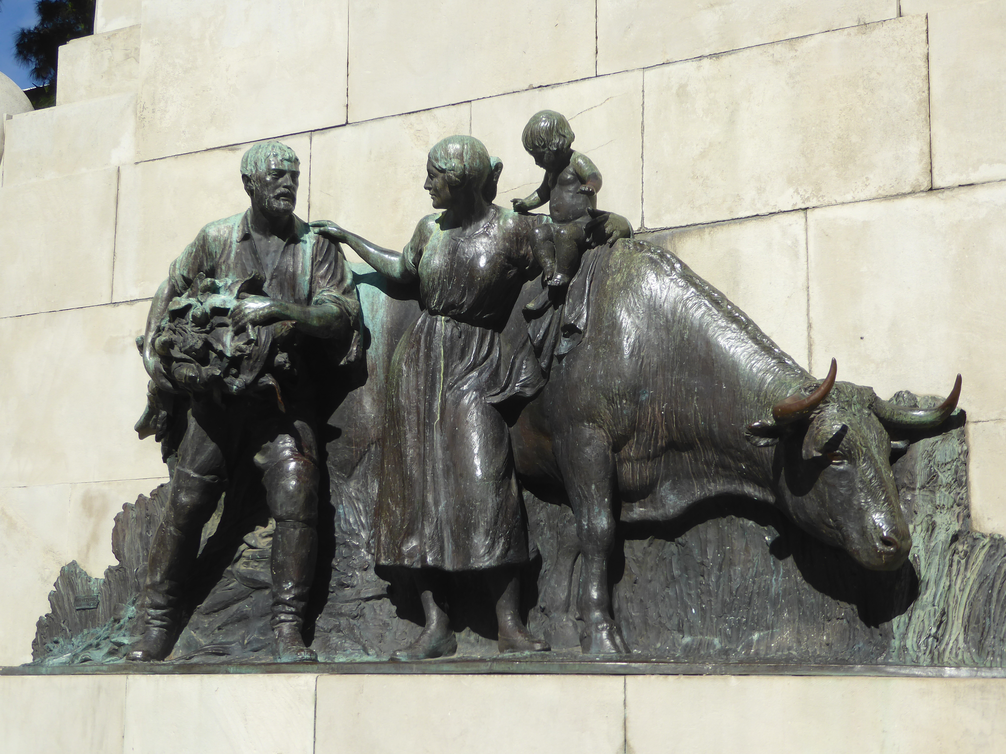 Grain production and beef remain very important, though I can't tell what the man in carrying. The cow seems to be thinking something like "