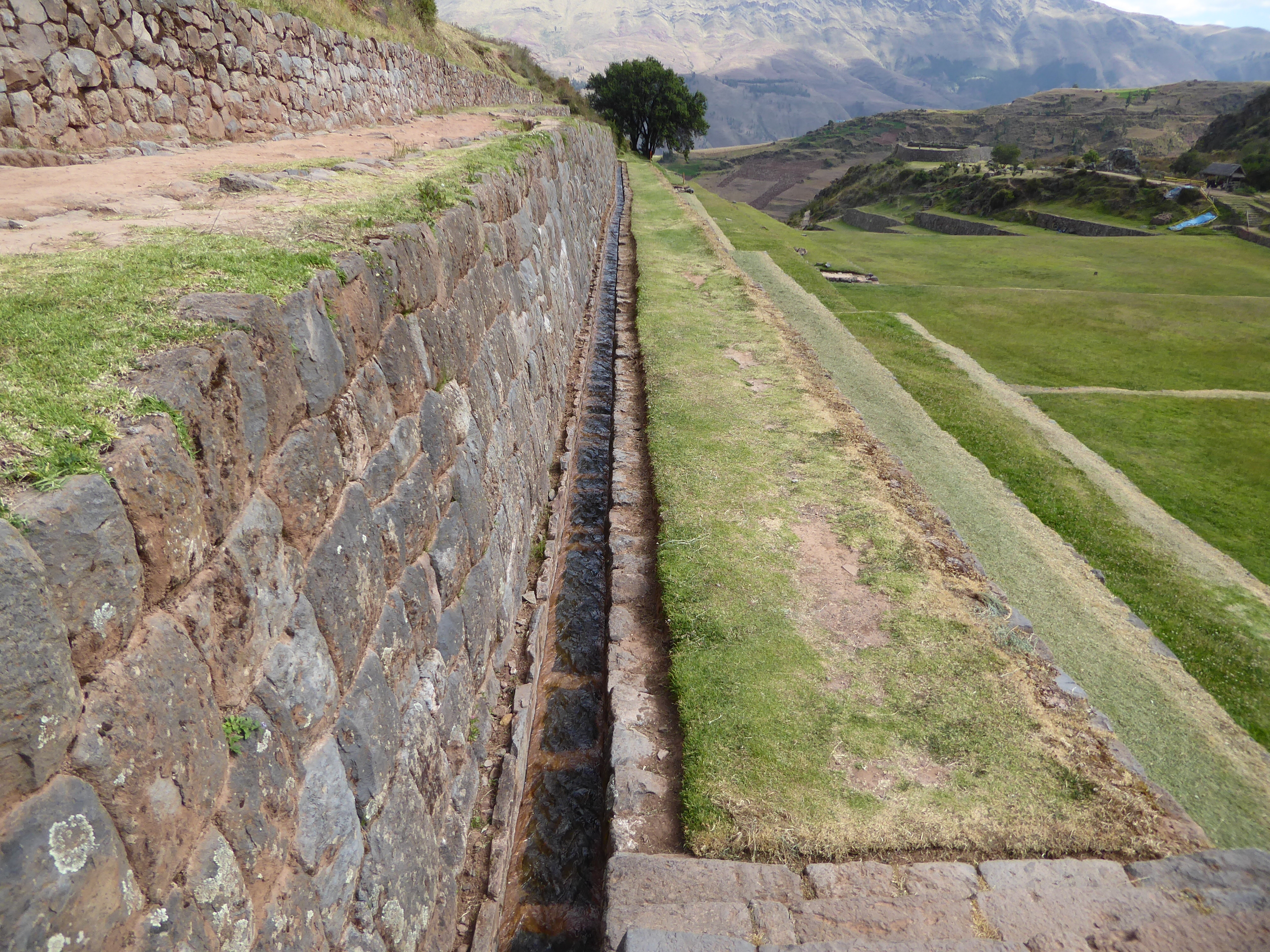 We'll chase the water downhill. There are three parallel canals running along this southern side of the valley wall, and there's one on the