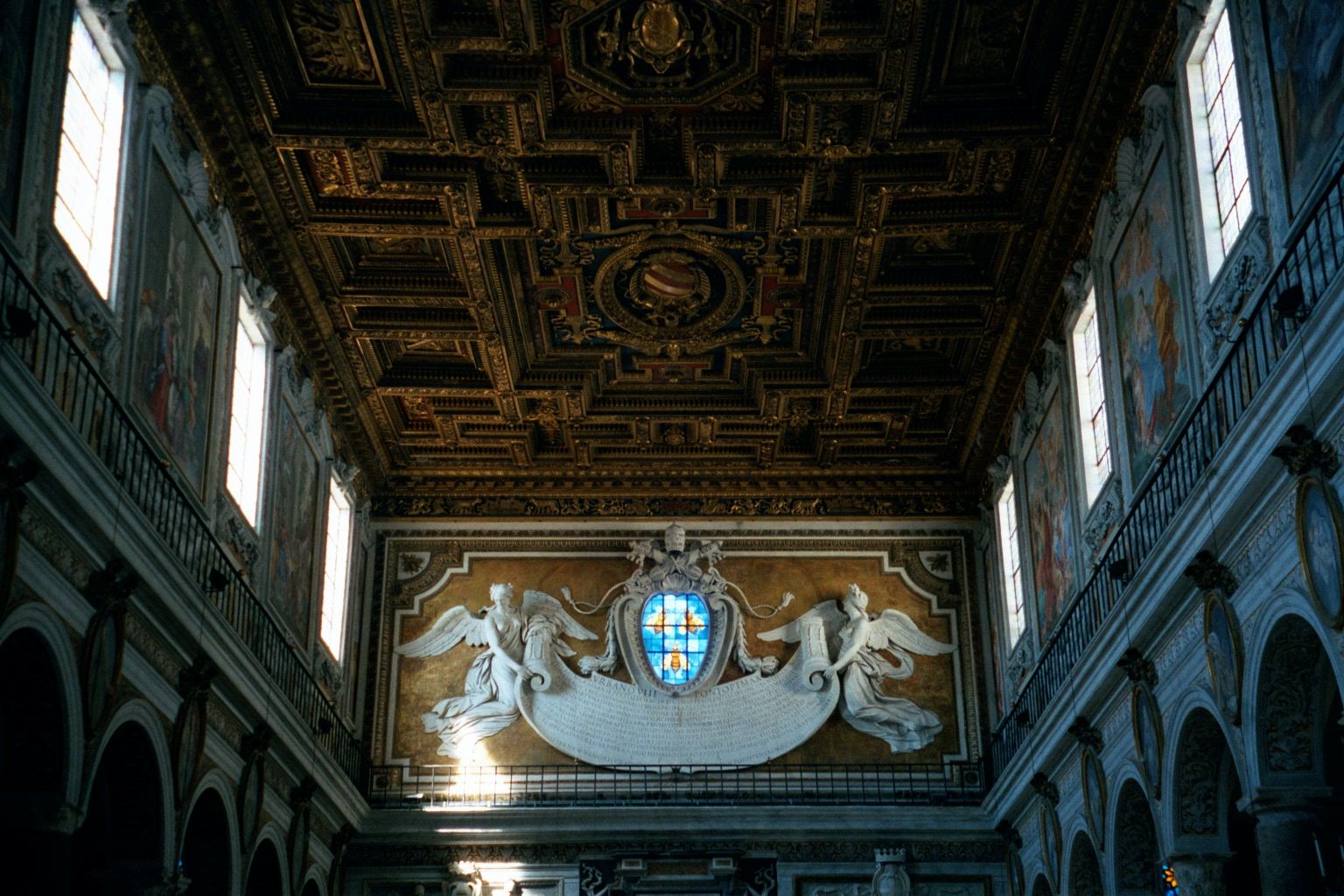 Rome has several of these basilica-style churches. Even when decorated with rococo flourishes, they are still restrained in comparison with