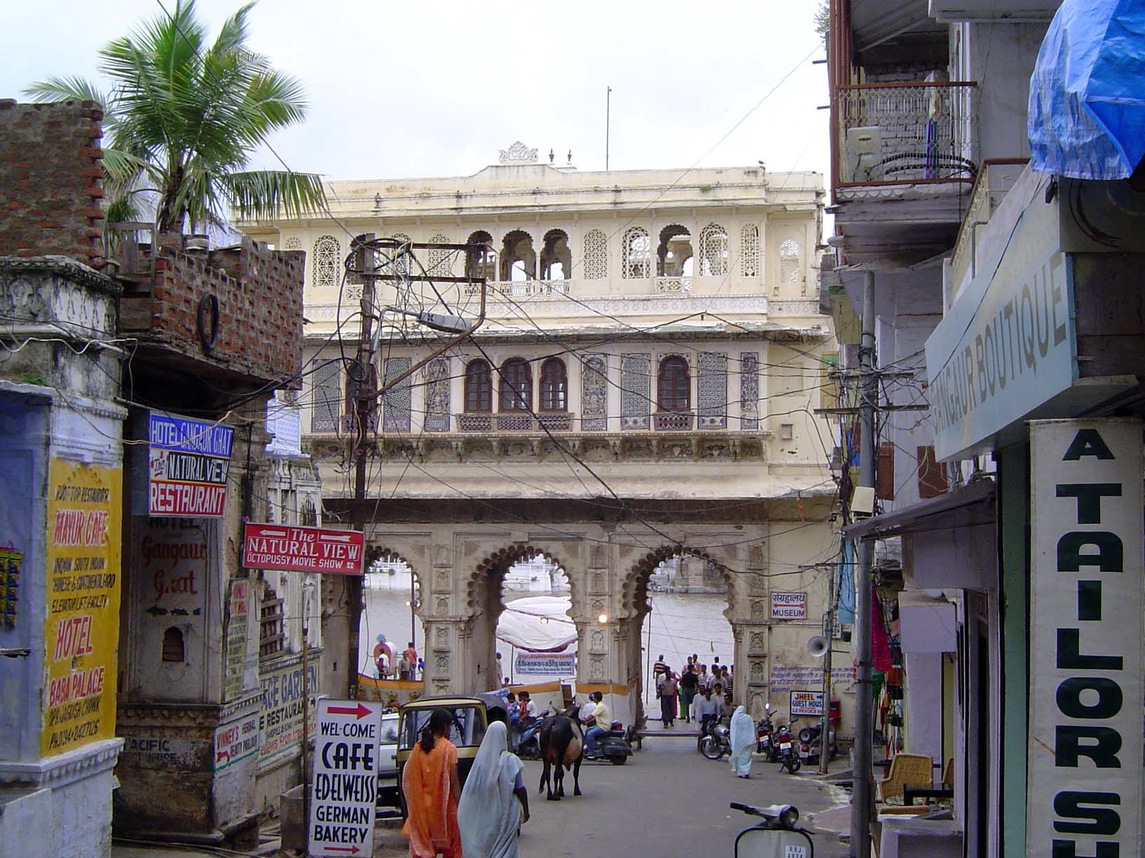 Now we've stepped back from the ghat and are seeing it through another Tripolia, added in 1878. It's the waterside entrance to another palac