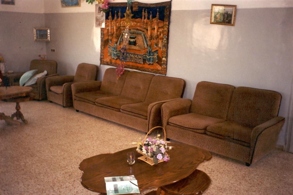 Upstairs, there's a modern, flat-roofed addition with this "best room" and an image of Mecca.