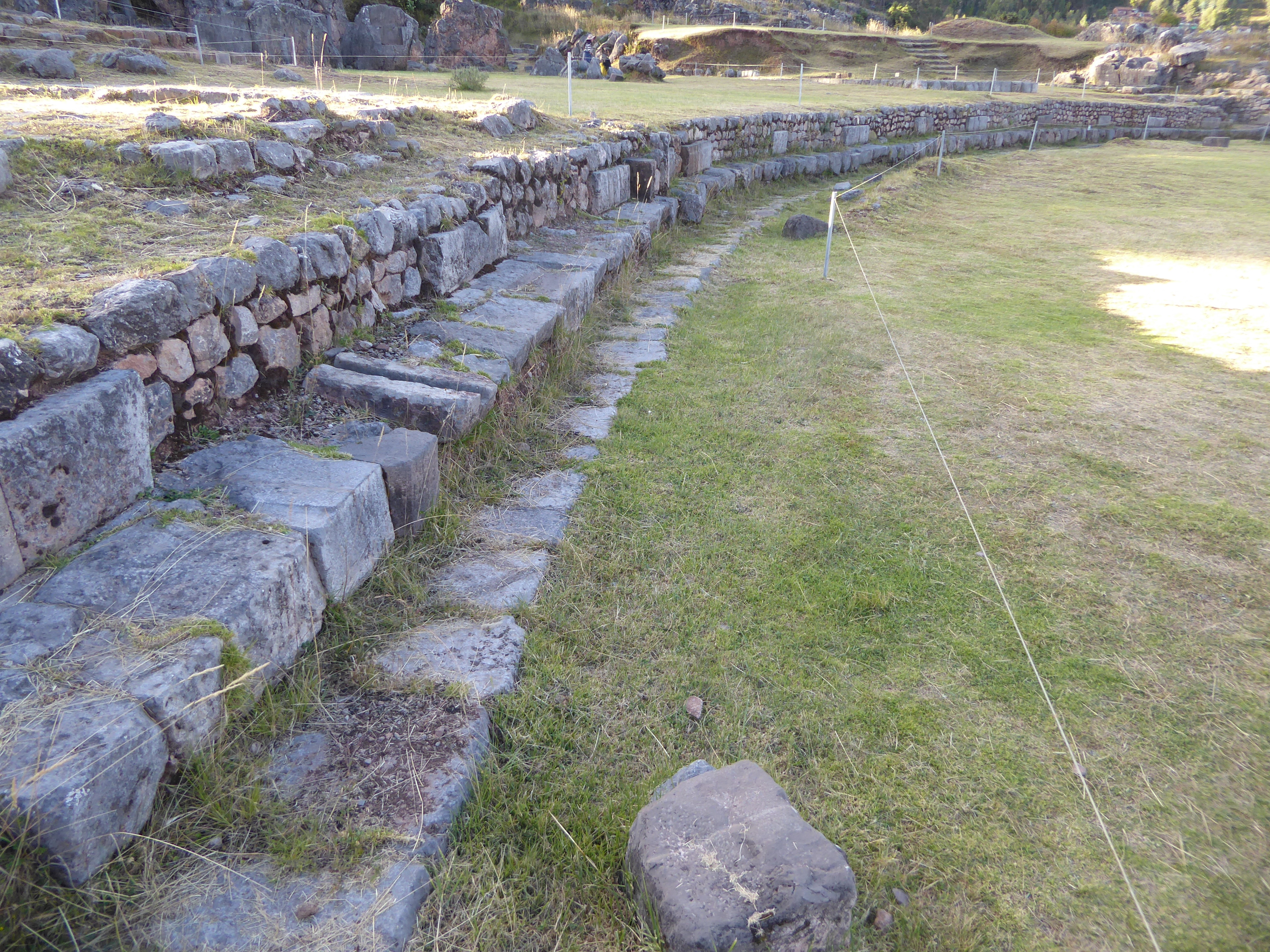 It's a reservoir equipped with channels for filling and draining, but the seating suggests a ceremonial function as well. Ritual bathing cer