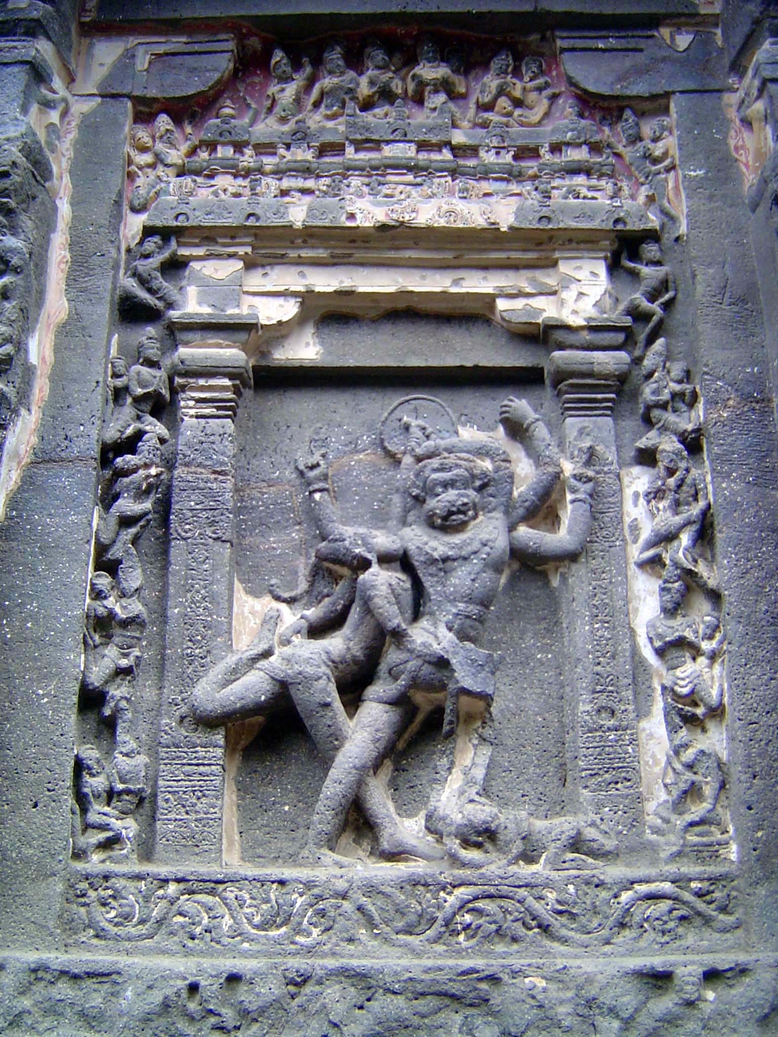 The base of the temple on this side contains several dramatic images. Here, Narasimha Vishnu's fourth or lion incarnation fights to free the