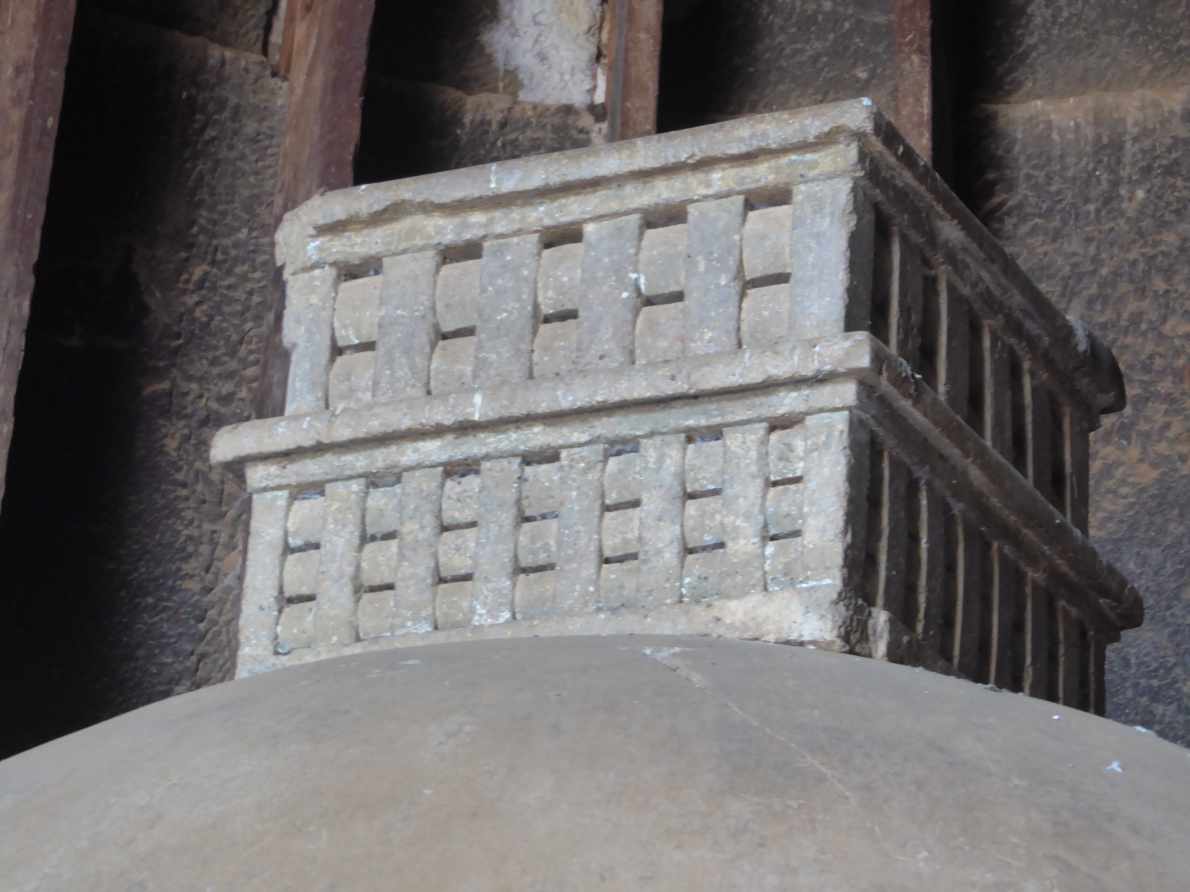 The box has the classic so-called Buddhist railing. Most of the dagoba is hewn from bedrock, but the upper box is not. Since we can't climb