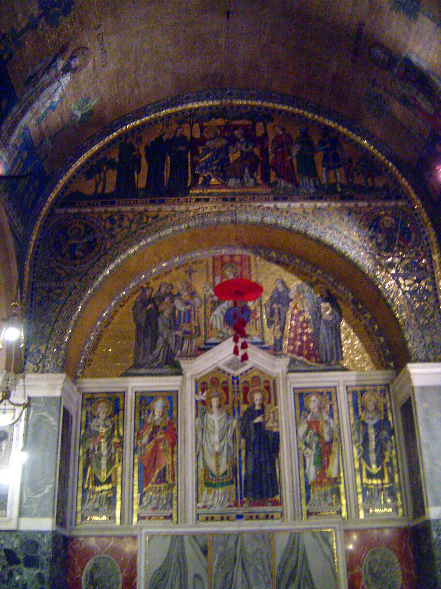 Several chapels hint at what might be done. This is the Chapel of St Gregory and St. Augustine. In the central panels Augustine stands in a