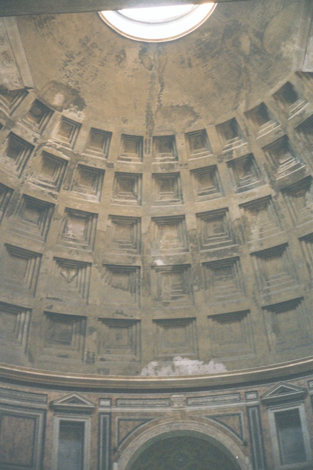 The coffered dome—142 feet in both height and diameter—is of brick and mortar, not concrete. It is lit by an extraordinary 28-foot apical ap