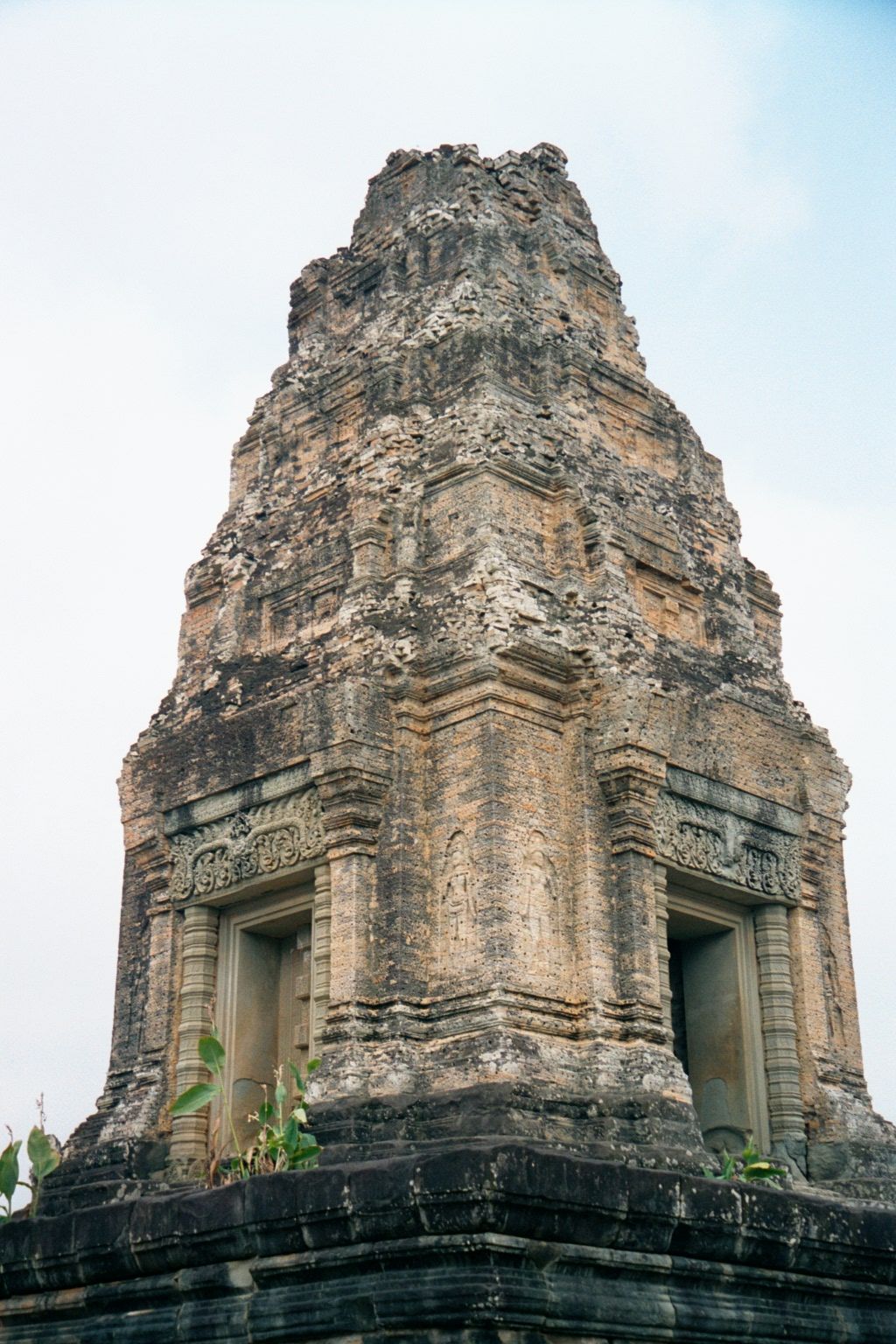 The East Mebon's towers are marked, as is so often the case at Angkor, by four doors, of which only the east shown here on the right leads i