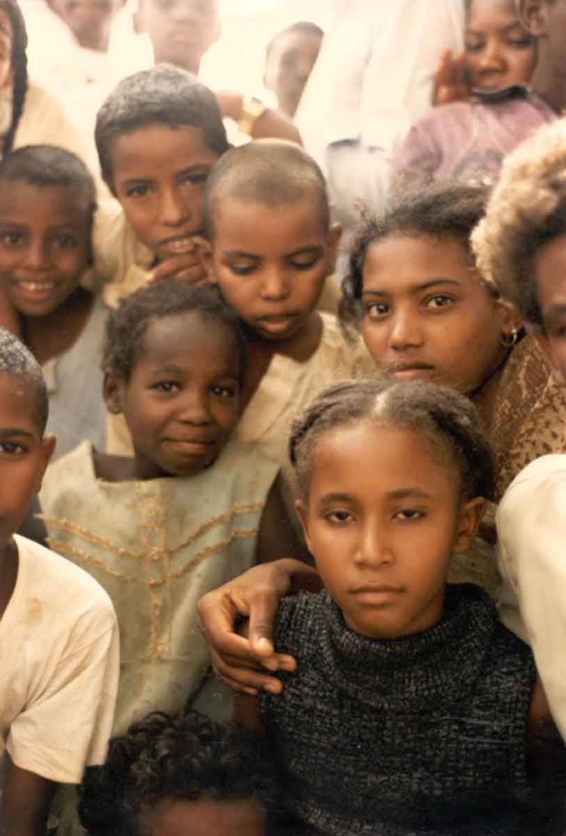 Women and children wait outside, along with one infidel. The girl in the foreground said that she wanted to become a doctor.