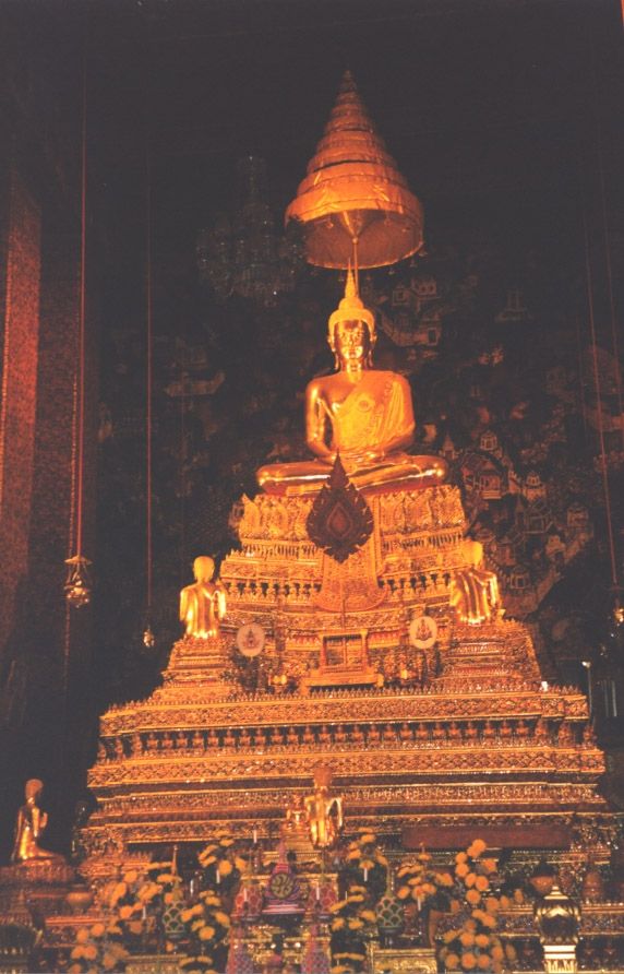 Interior of the bot or assembly hall Sanskrit chaitya at Wat Po. Rama I's ashes are under the image of the Buddha, which is of gilt bronze.