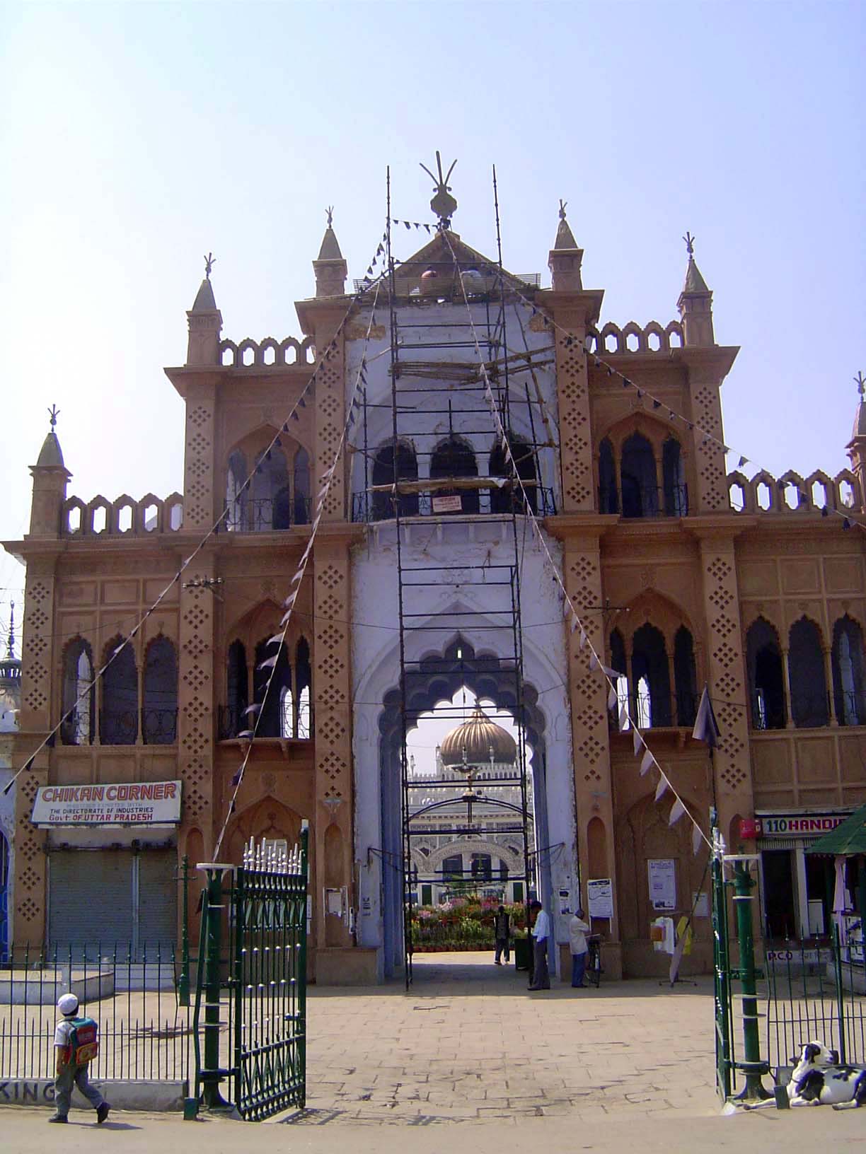 View from across the street; the imambara itself is straight ahead, with the gold dome.