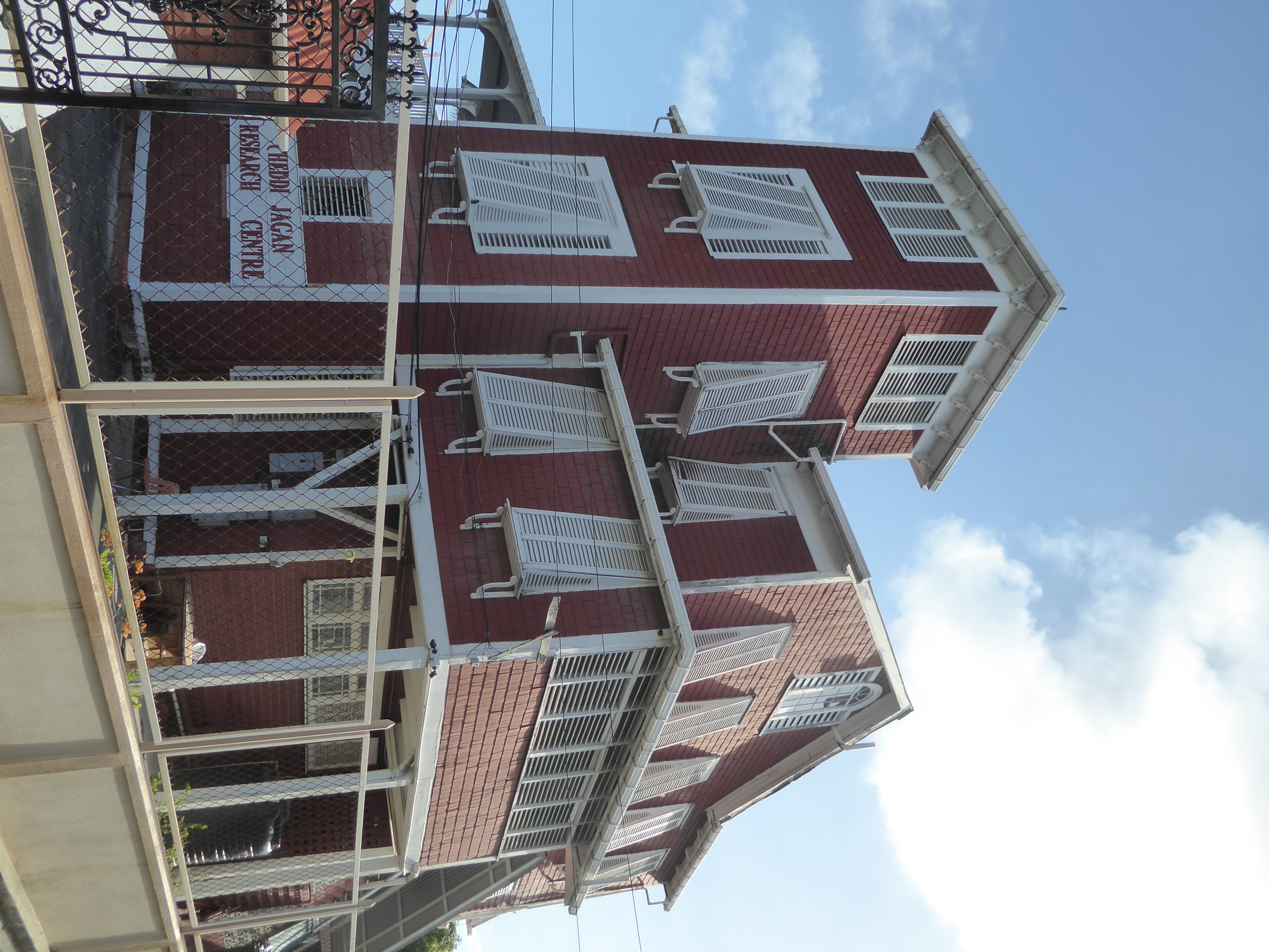 This, the so-called Red House, was the home of Eustace Woolford 1876-1966, one-time mayor of Georgetown and Speaker of the Assembly. The gov
