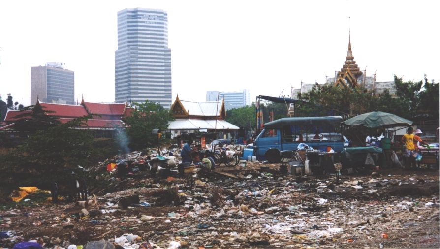 The slum adjoins both a dump and the venerable Wat Padum Vanaram.