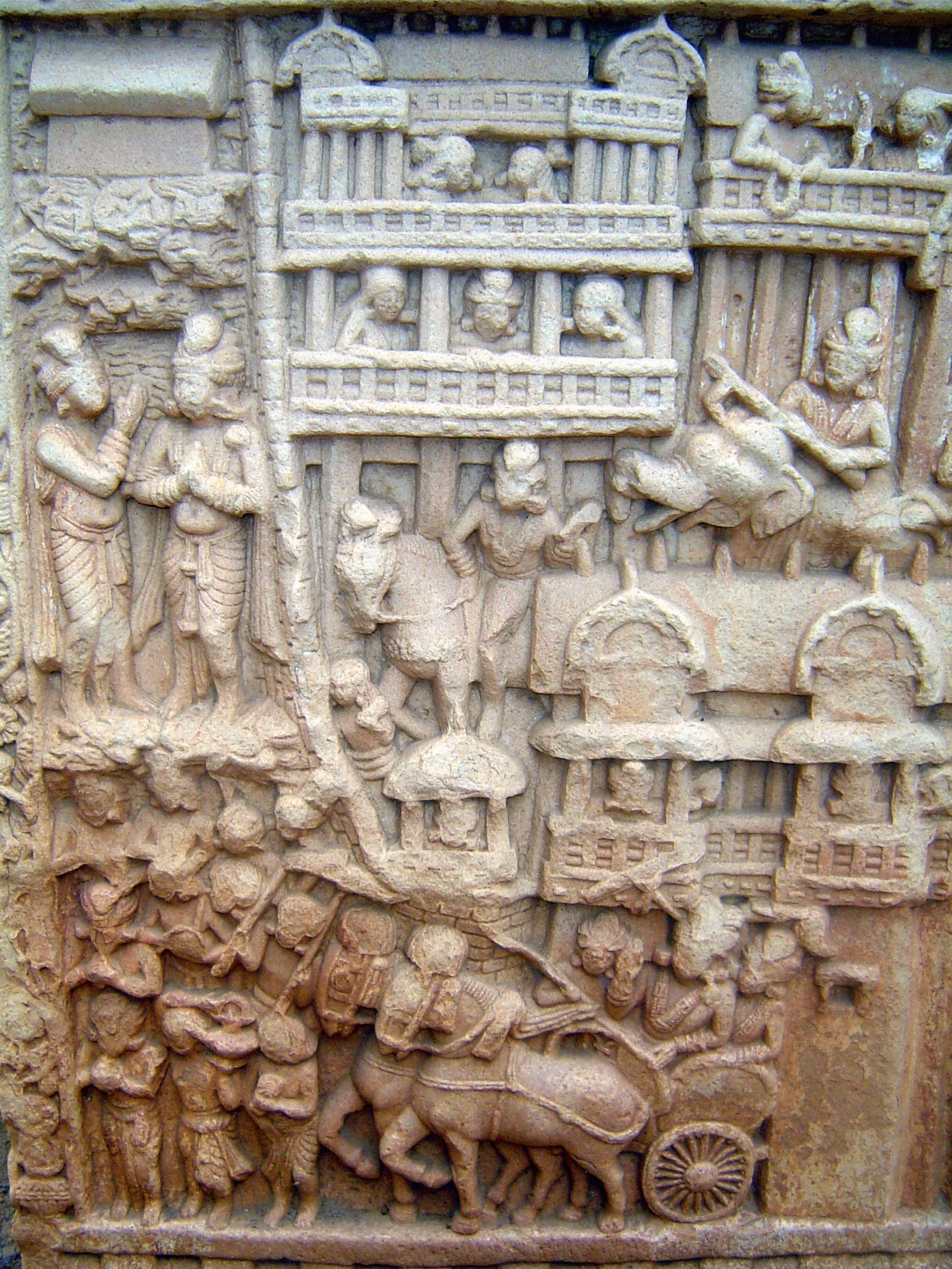 This panel is immediately below the preceding picture. The Buddha has brought new disciples to Magadha, the town shown at the top. King Bamb