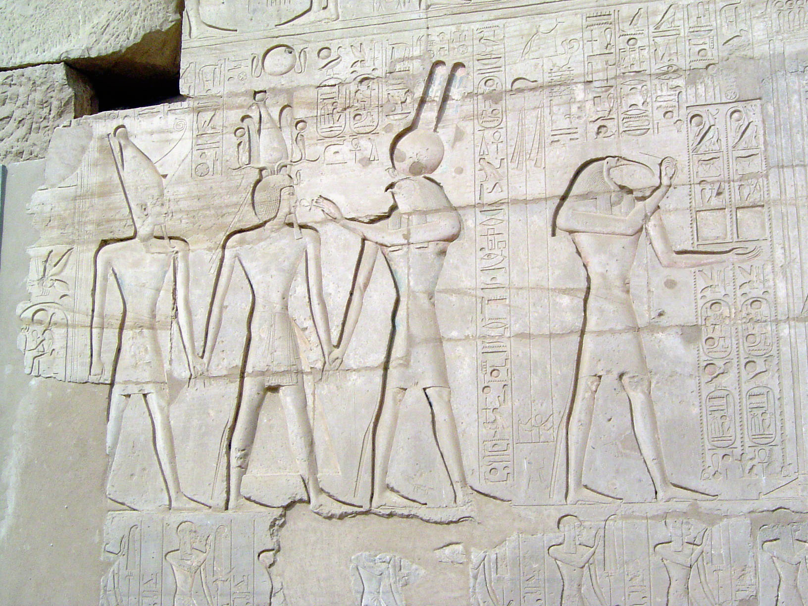 A closer view of the escort party. On the right, the ibis-headed Thoth, scribe of the gods, pen in hand.