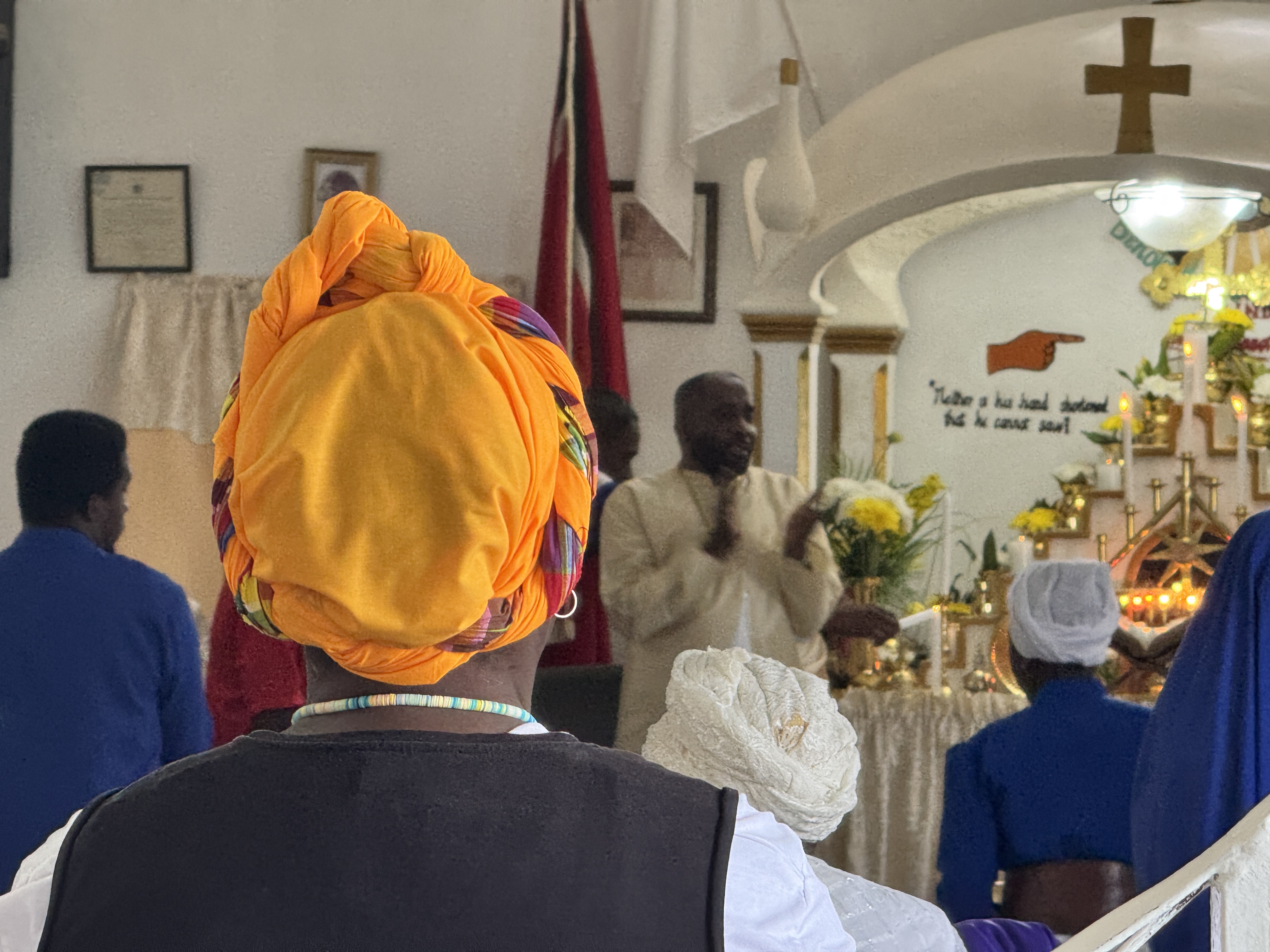 Clapping together, led by the minister.