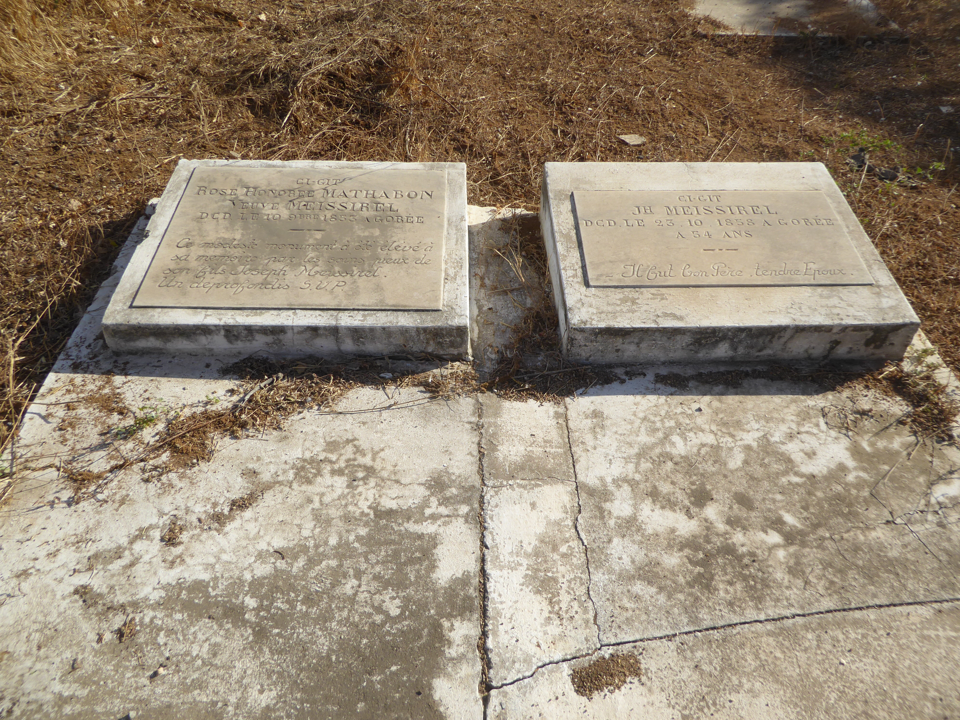 The stone on the left recallas Rose Meissirel neé Mathabon, who died on Gorée in 1853, before the French began developing Dakar. On the righ