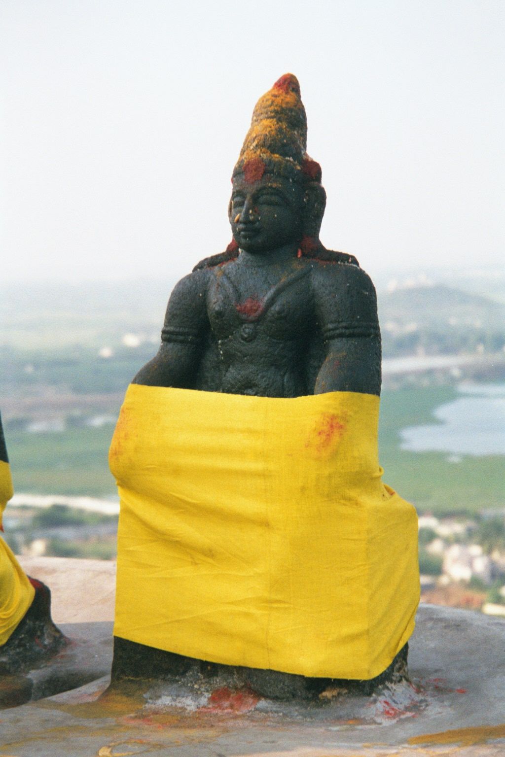 Dakshinamurthy, or Shiva as teacher, literally "the one facing south." Few if any other Hindu gods are positioned in that direction.