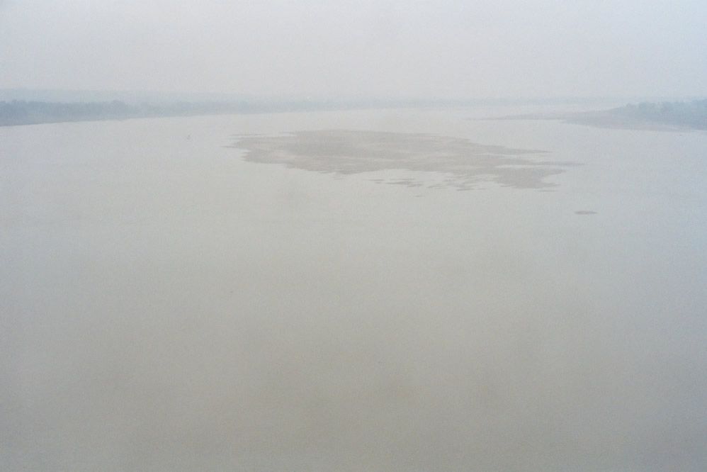 The view from the hill and looking northeast and downstream, toward Varanasi. This is the point where the Ganges makes it great northerly tu