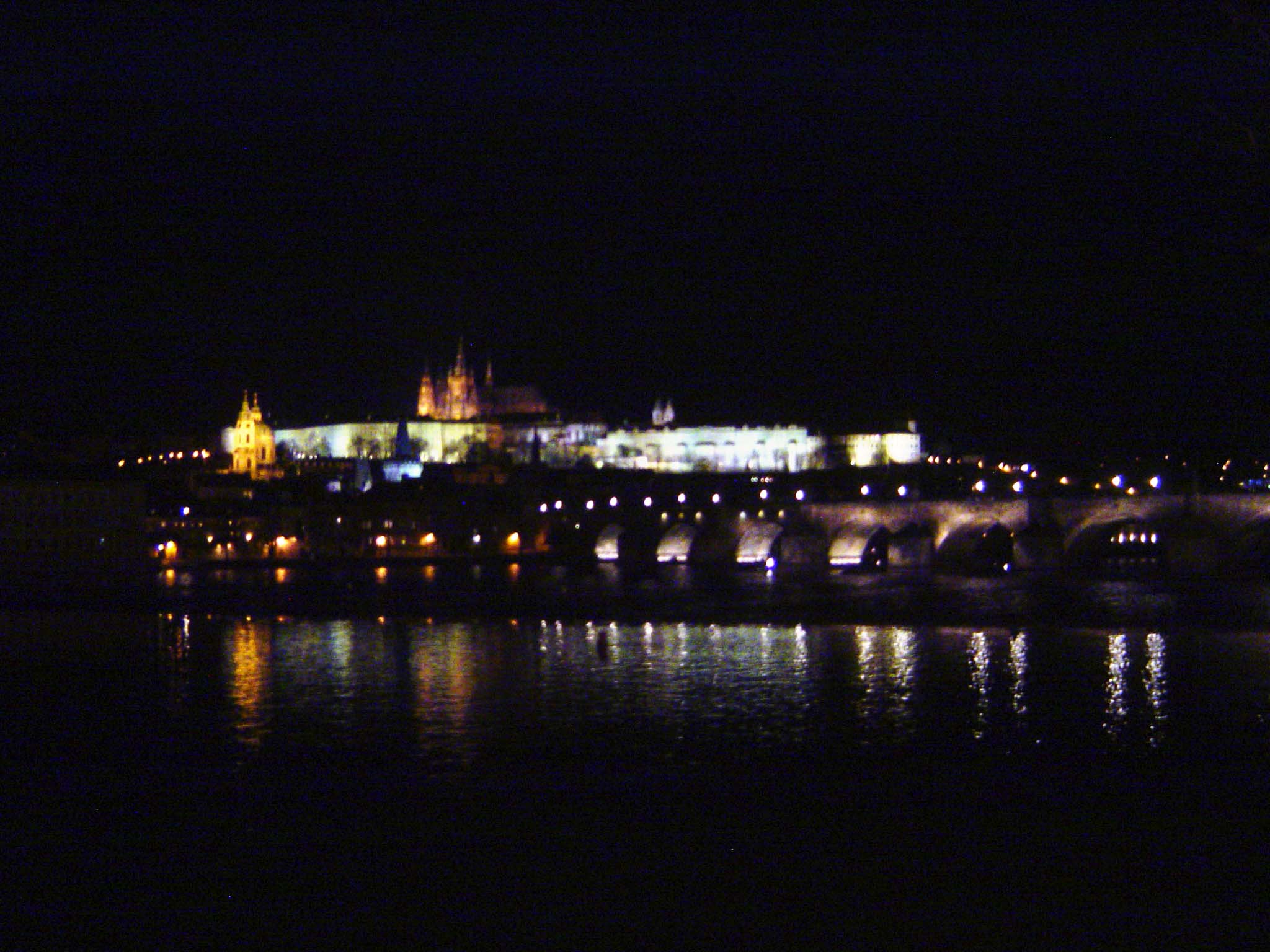 The Vlatava River wraps the city as in the crook of an elbow. A castle was built on the hill opposite by 900. It too—Prazsky Hrad or Prague