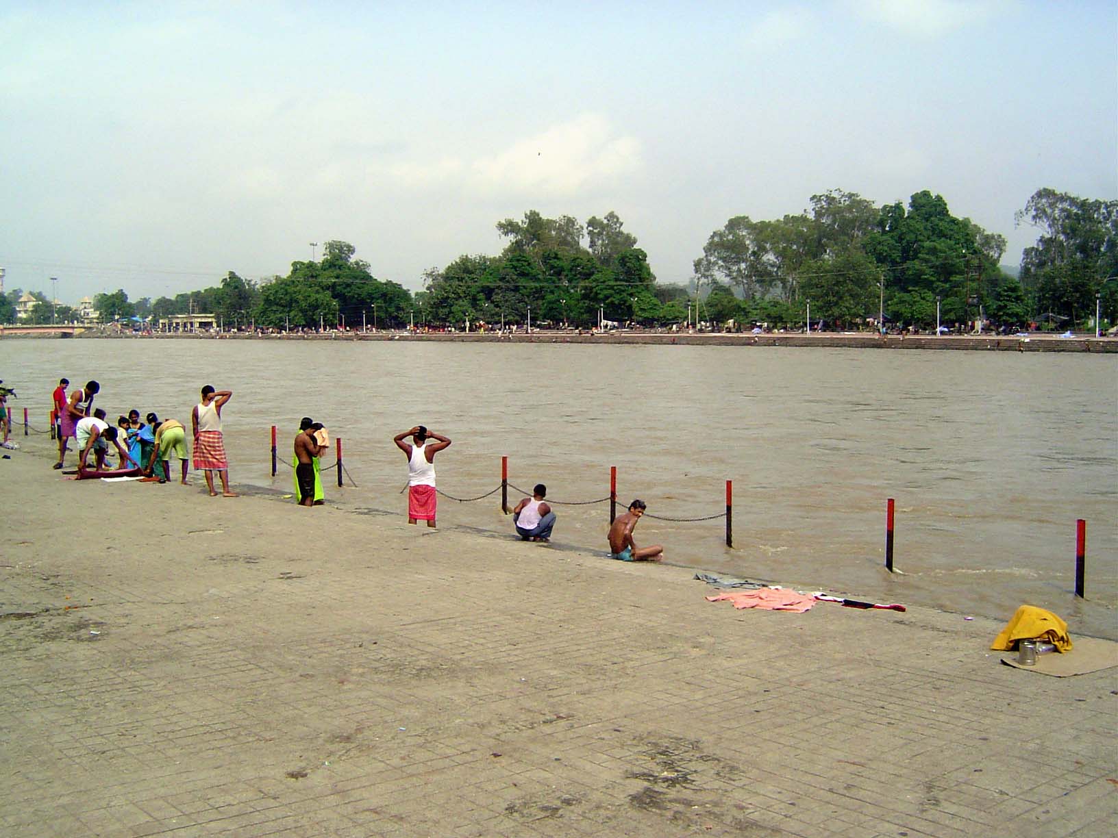 A few miles away, bathers have come to the sacred water.