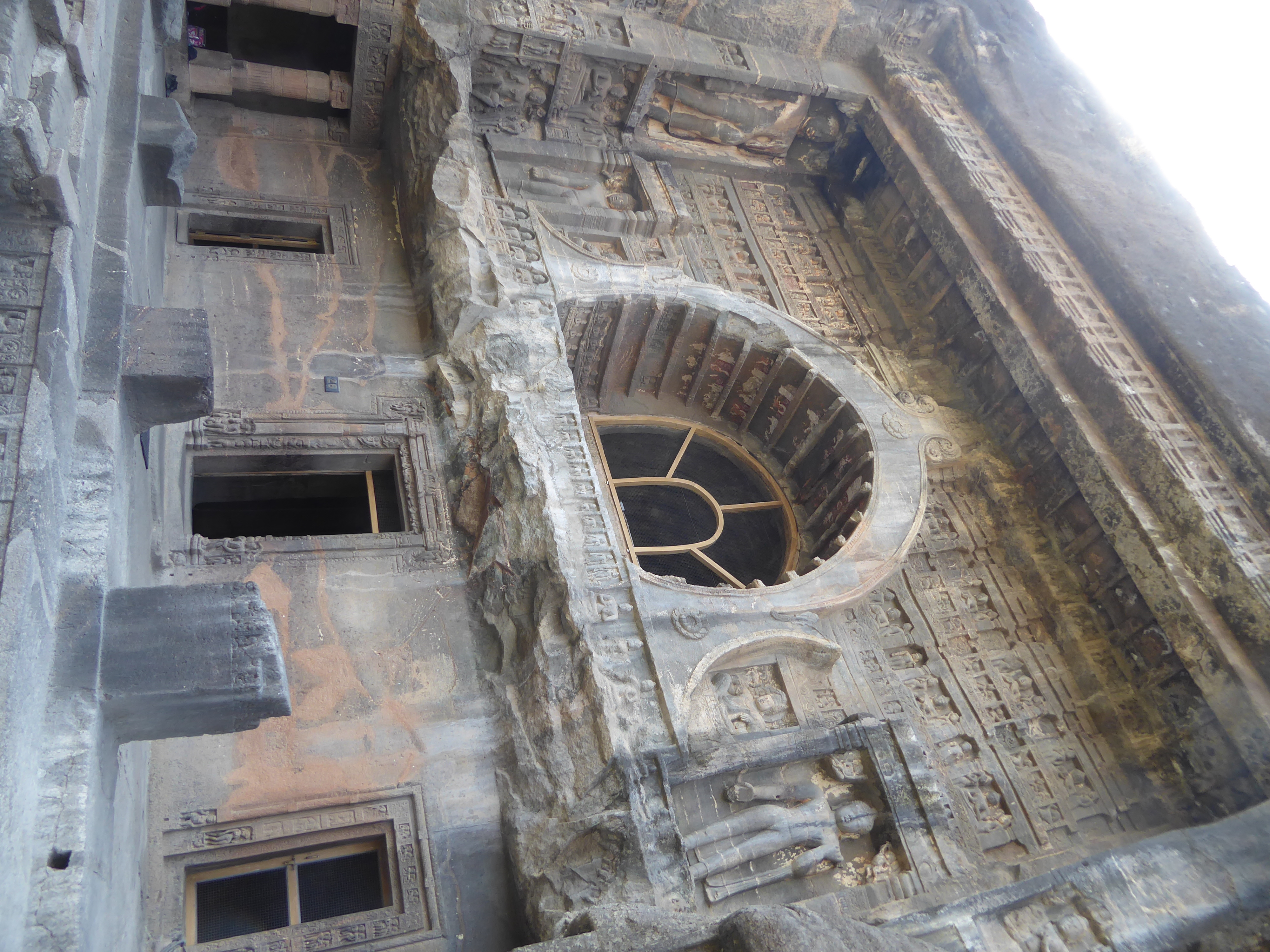 A veranda has collapsed, leaving behind a jagged edge and the stubby bases of columns, bits of which survived into the 19th century and are