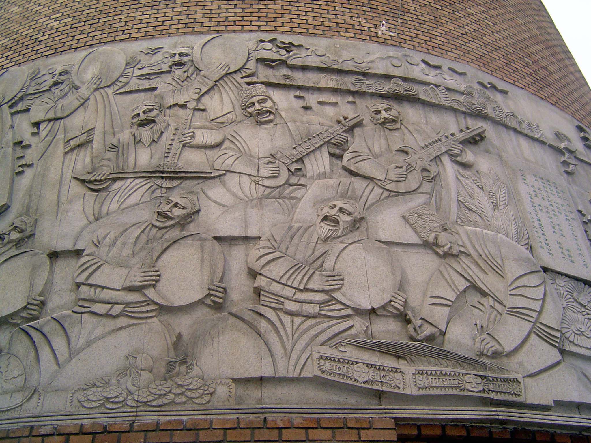 Here it is; figurative sculpture on a make-believe minaret. The musicians are having a party, but who is responsible for it?