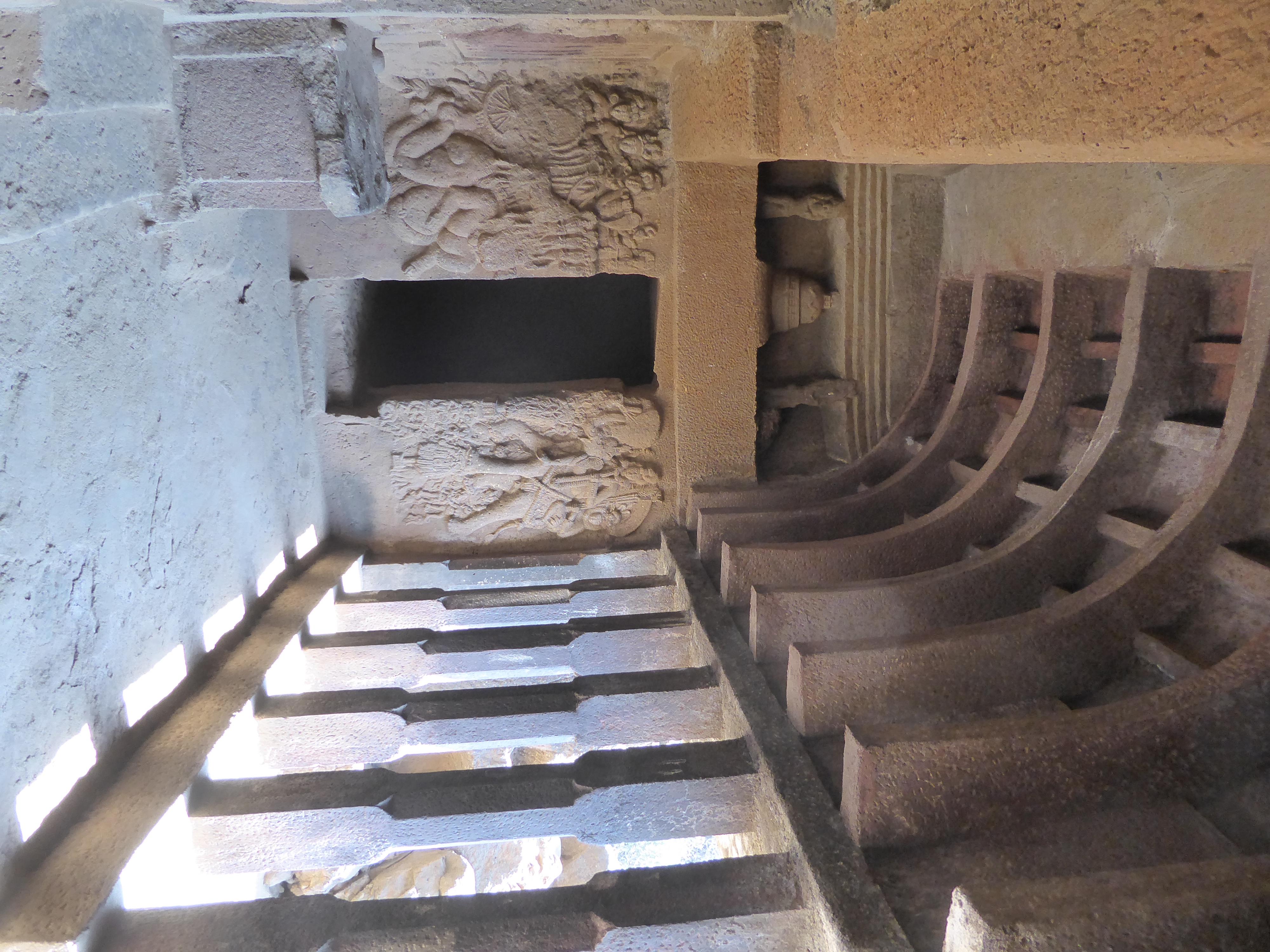 So the columns are ASI work, as are the curved beams, which are absent in old photographs. The figures on the wall are old, however, and the