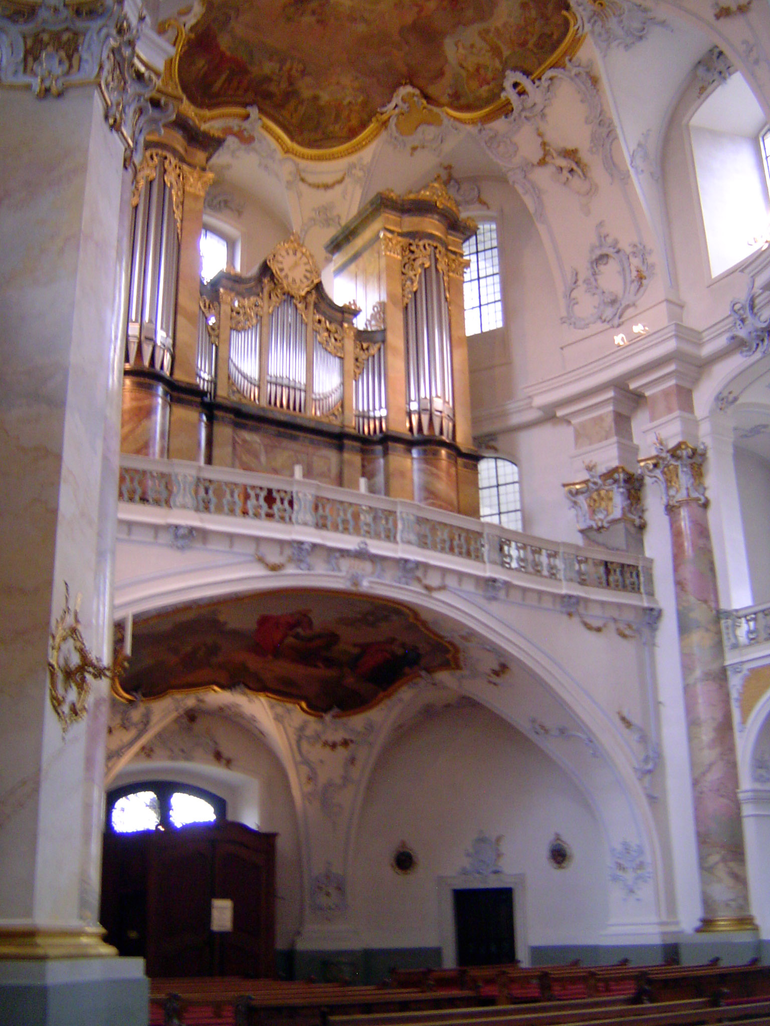 He has in mind, at least in part, the complex curvature of the ceiling.