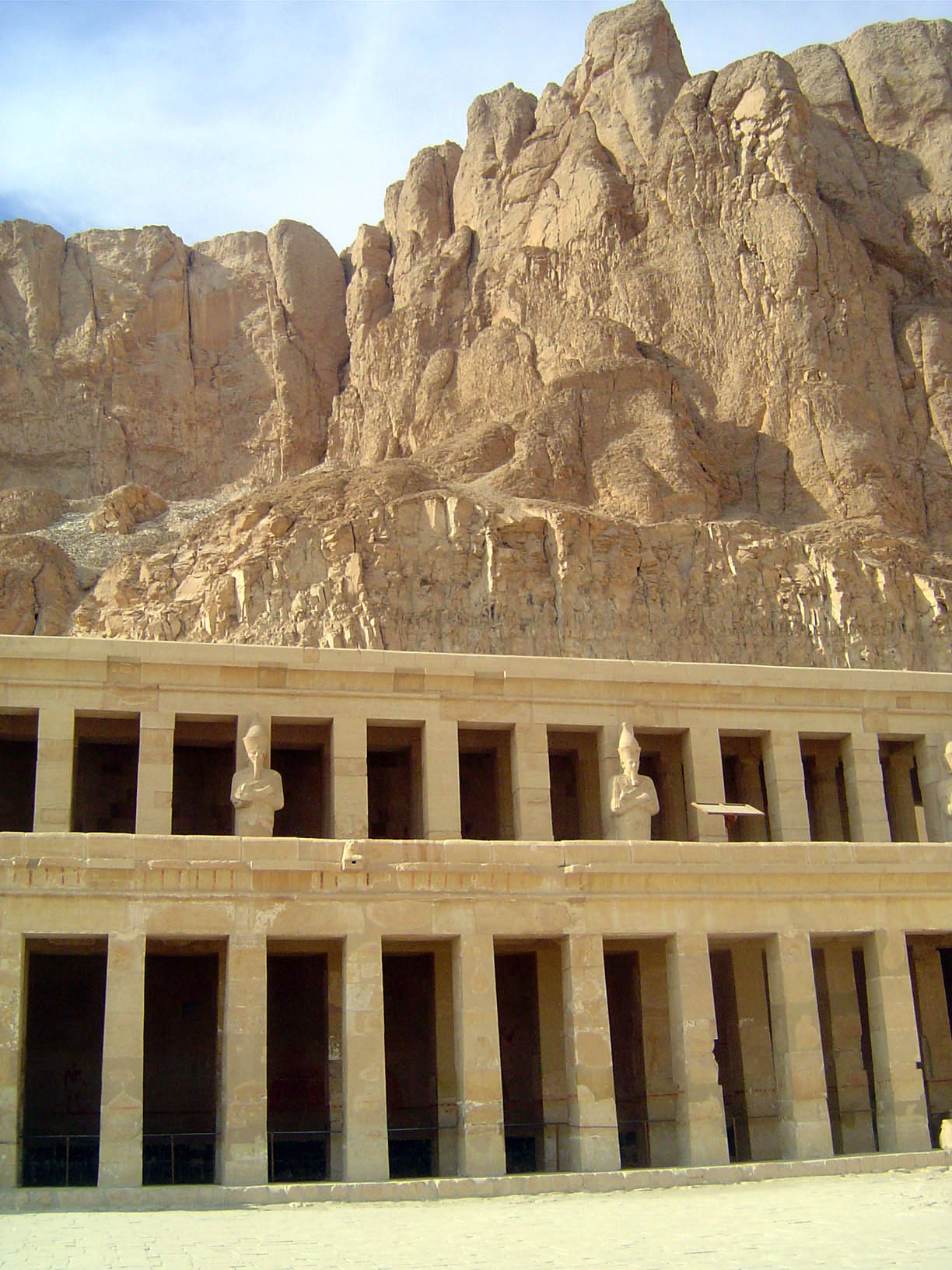 The middle and upper colonnades, the upper with statues of Hatshepsut as Osiris.