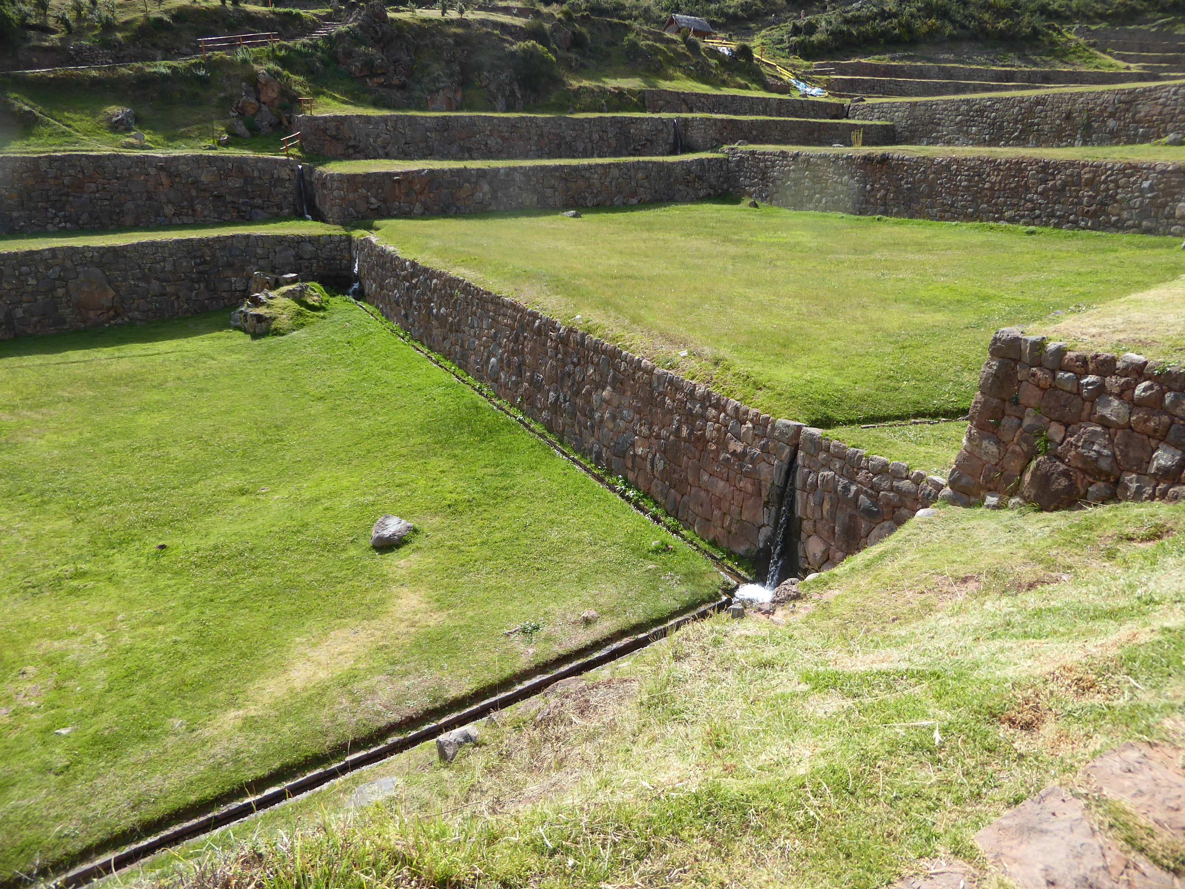 Surplus water drops to the next terrace. The terrace set has a slope of about 12 percent to insure that water flows from top to bottom. Nor
