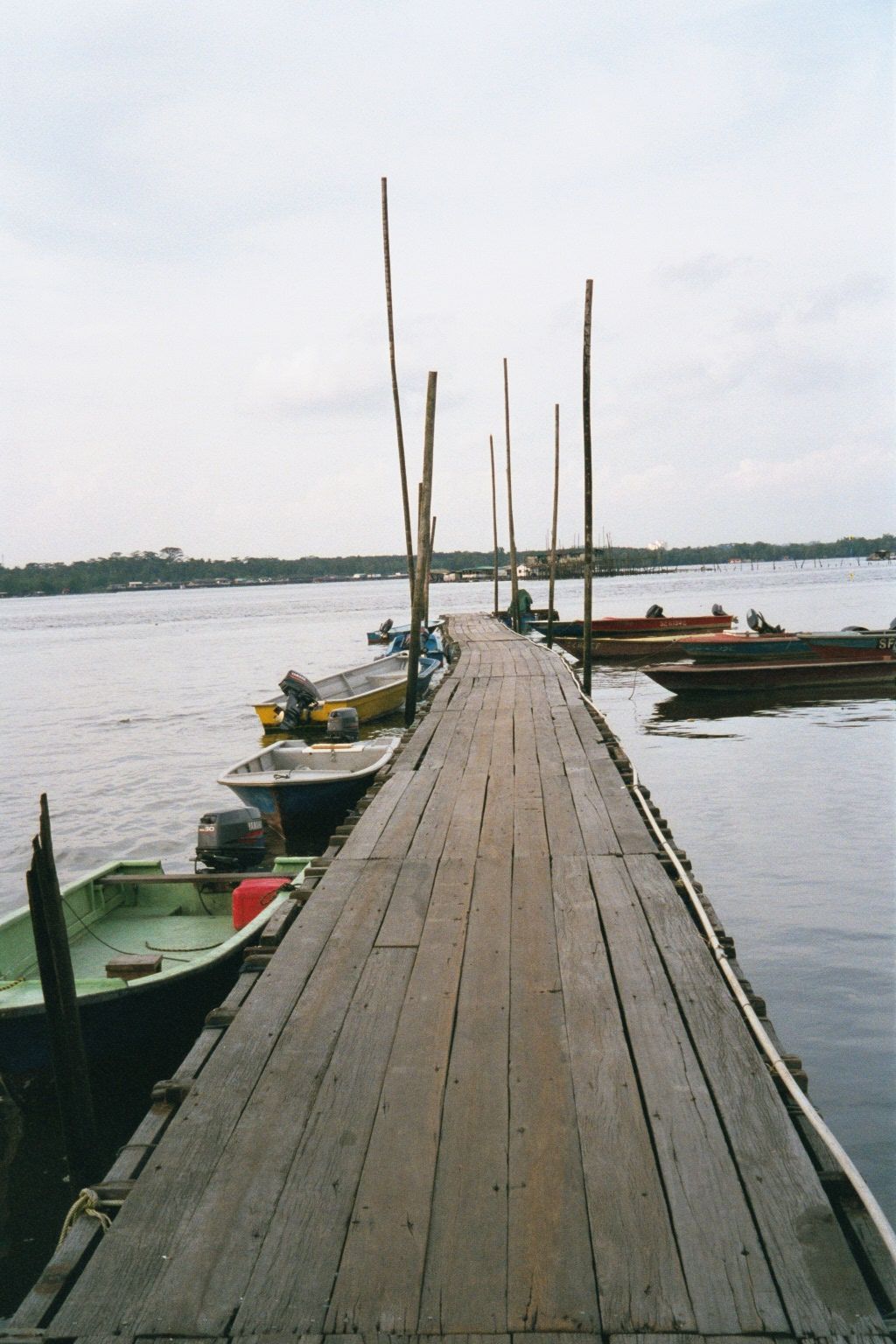 North of Boon Lay and at the end of Lim Chu Kang Road there's an active pier for fishermen. The water is the Selat "strait" Johor, with Mala