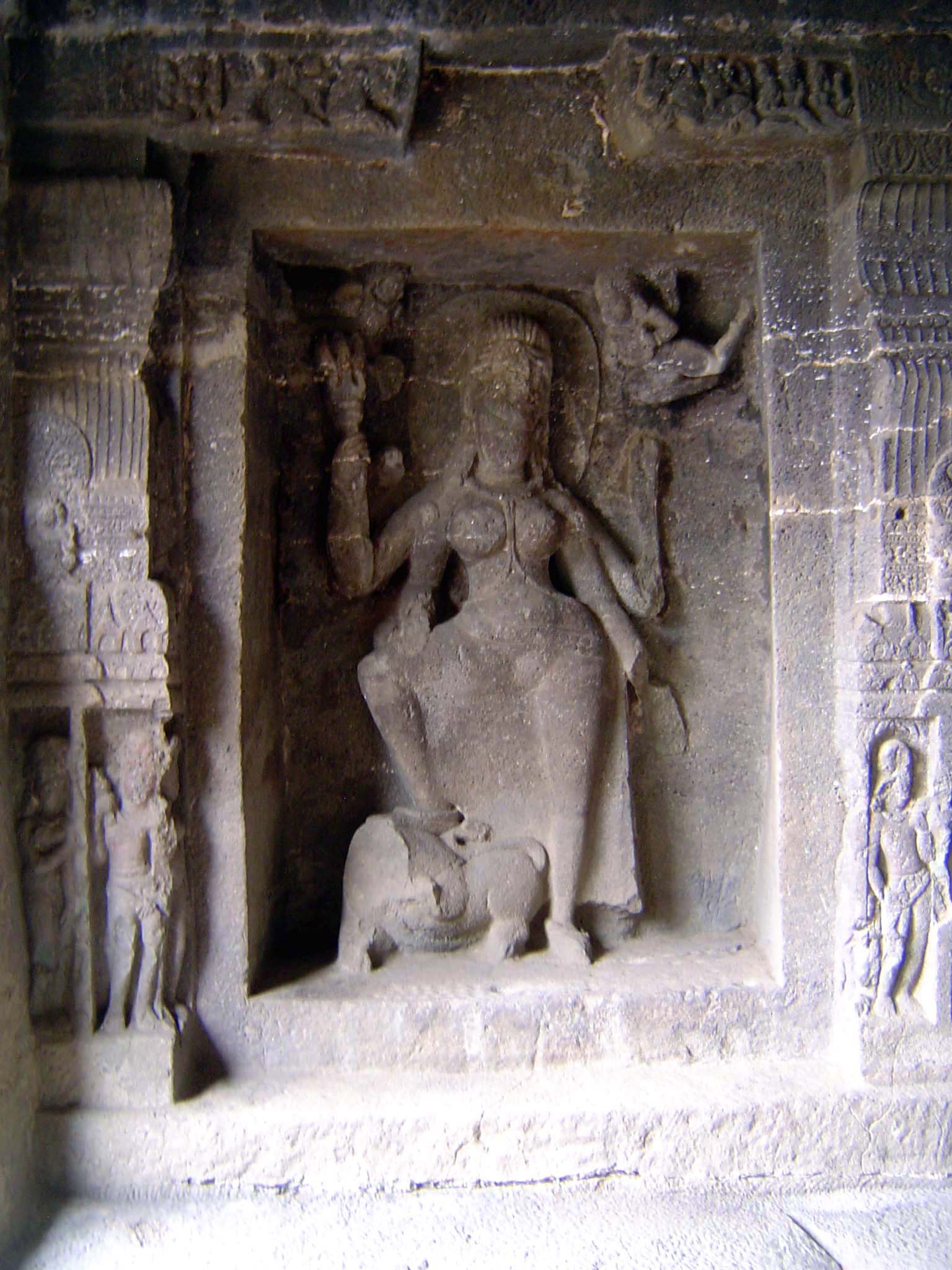 Durga, foot on lion and trident in hand.