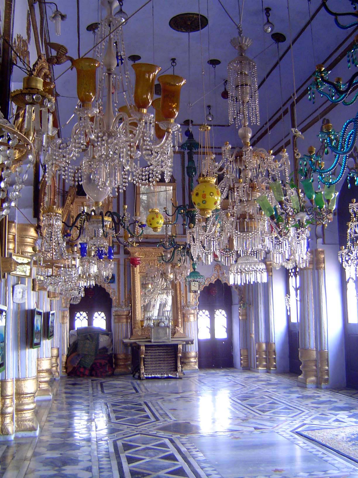 Entrance hall, with a riot of chandeliers.
