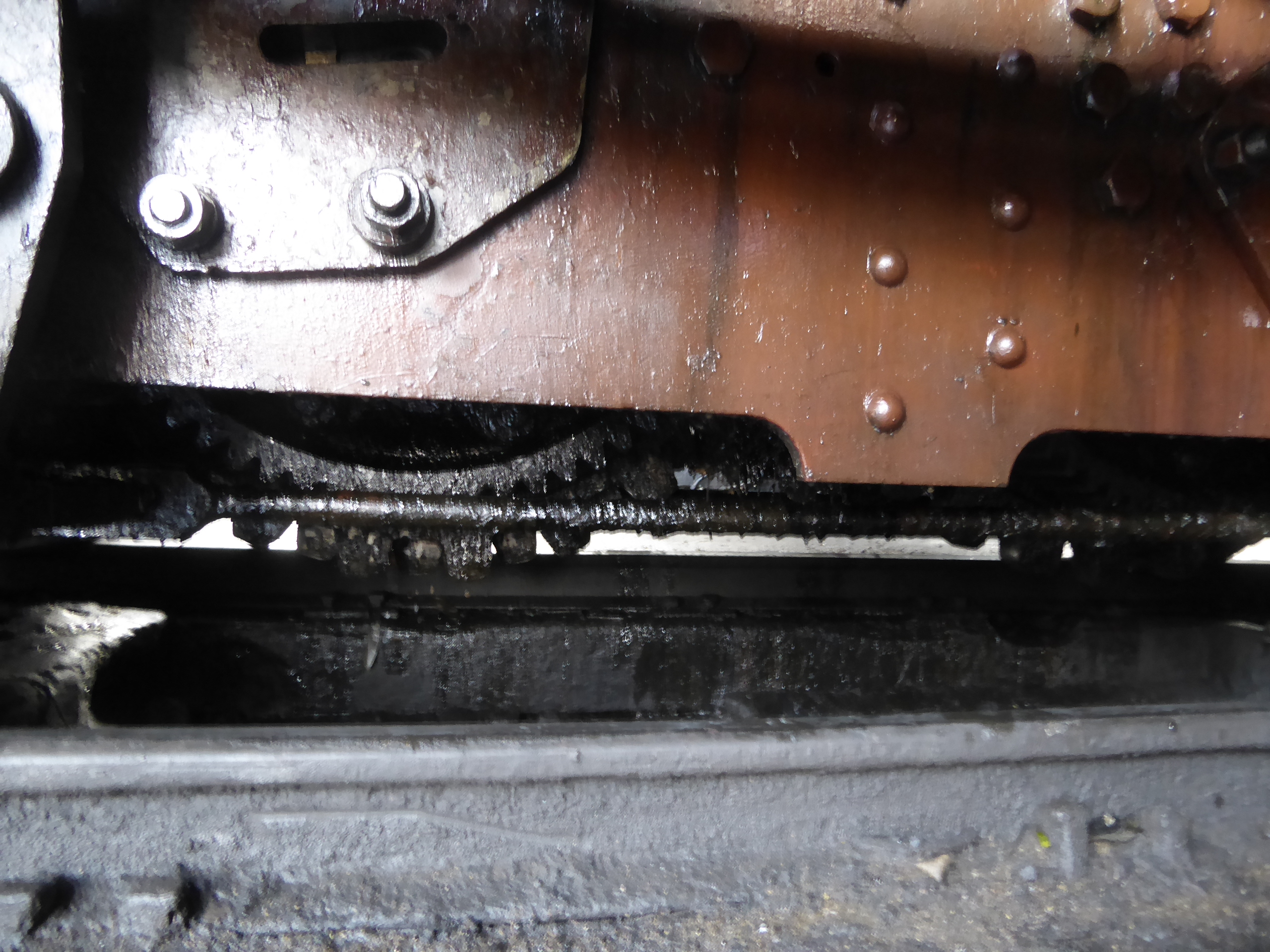 Maybe you can see the greasy cog that meshes with the rack.