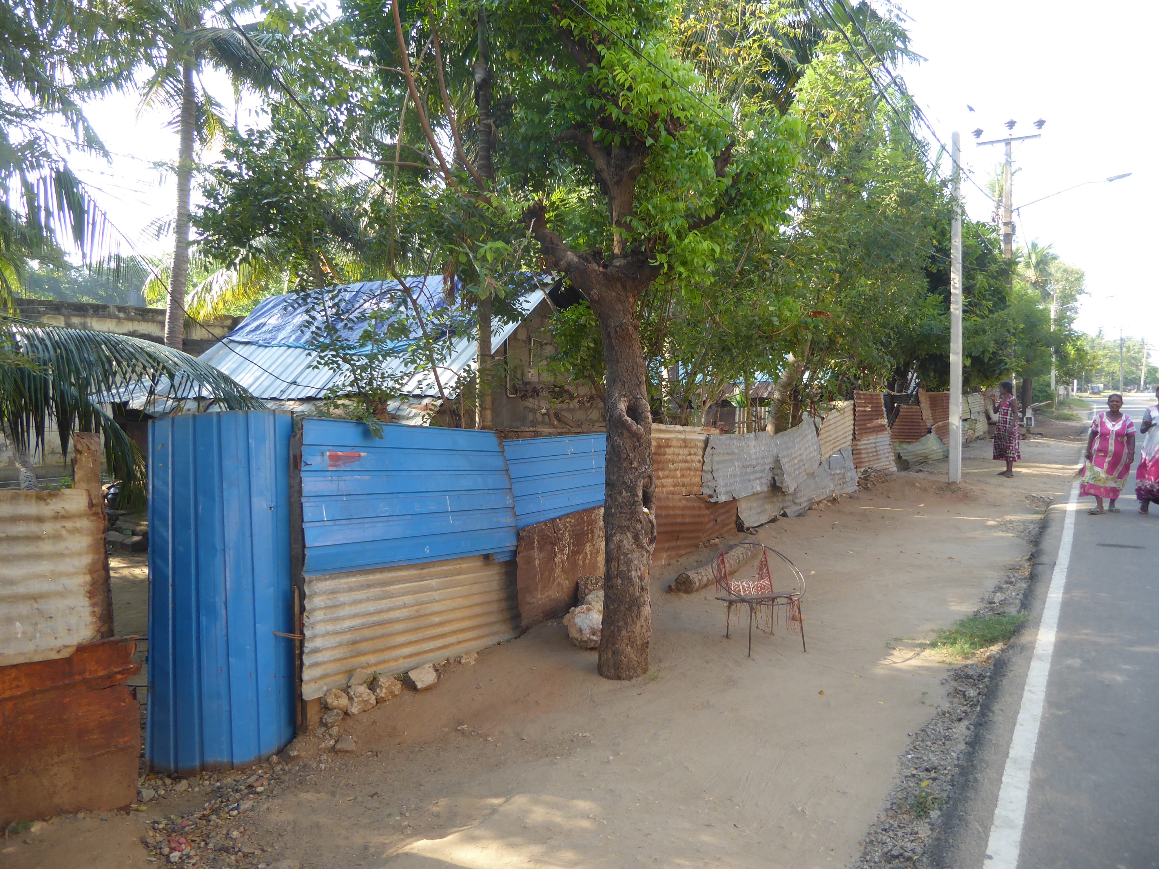 Housing in Jaffna and across the peninsula surrounding it is usually obscured by fencing, most commonly cheap metal sheeting. The view here