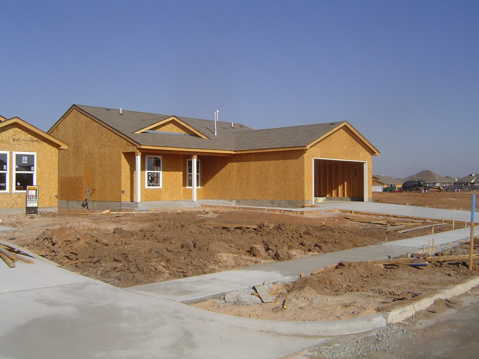 Continuing the checklist: 10: Deck the roof and make sure it's braced properly. 11: Roofer goes to work, while framers install the windows.