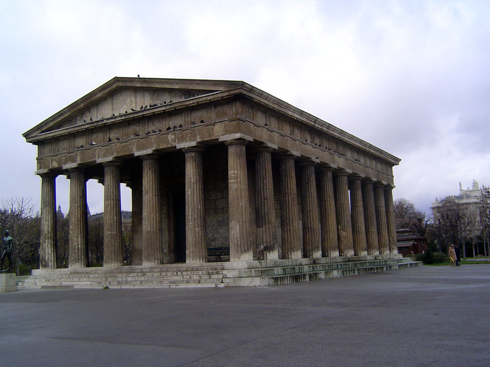 Behind Karl is the Theseus Temple, designed by Peter von Nobile to accommodate a sculpture by Canova of Theseus slaying the Minotaur. The st