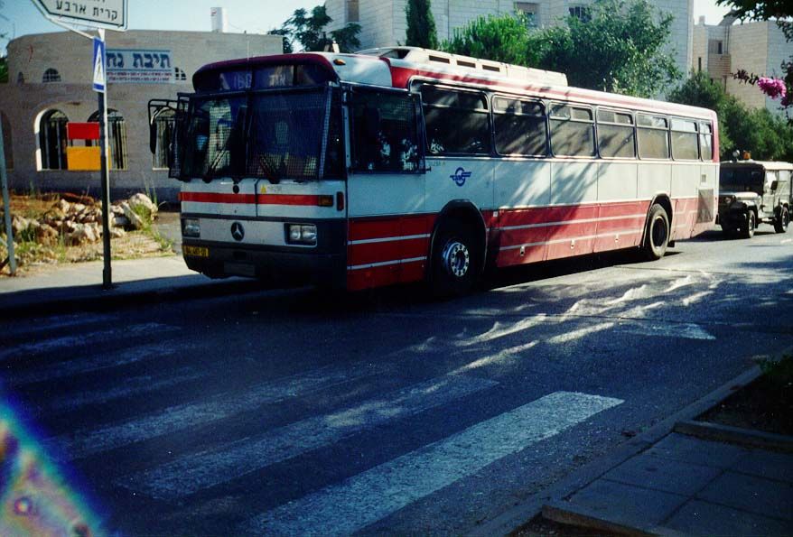 Most settlers commute to jobs in Israel, especially Jerusalem or Tel Aviv. Most often, they travel by public bus, here escorted to Hebron's