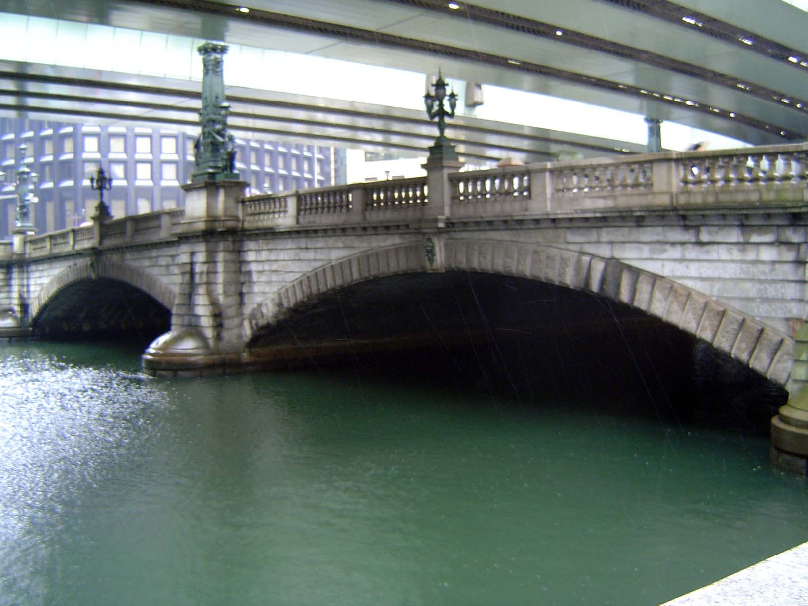 Nihombashi was rebuilt in 1911. Old photos show the new bridge sparkling white against a dark background, including a crude railway trestle