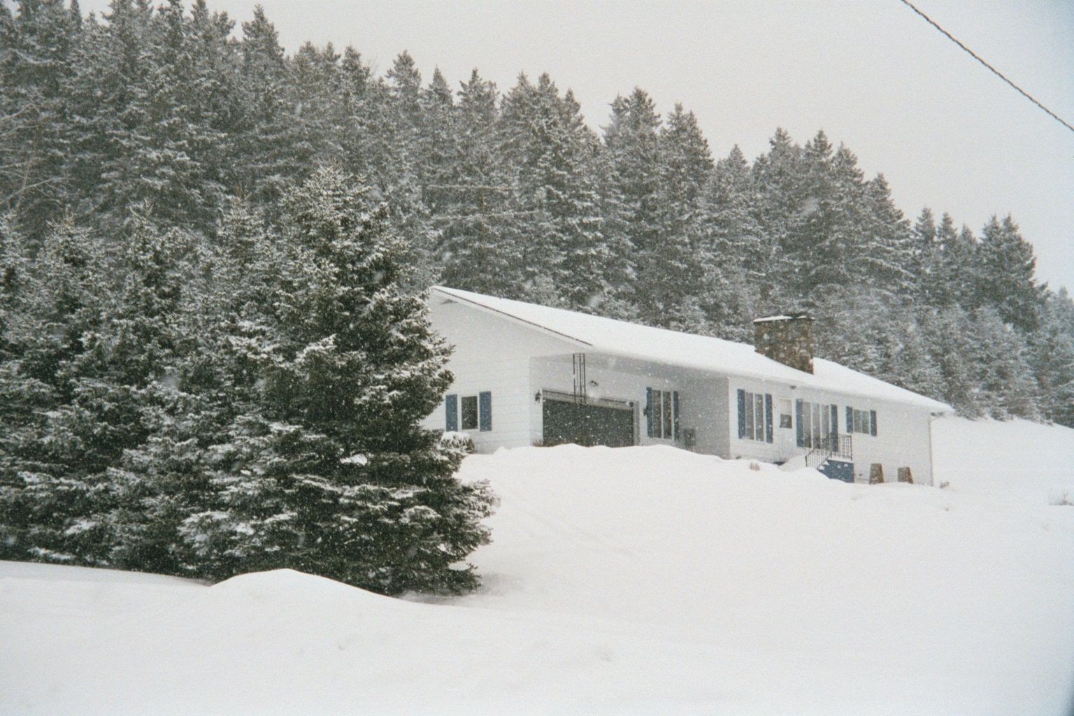 The replacement house, built about 1975. The owner has survived partly because he has plenty of wood to cut during the winter. It's the cash