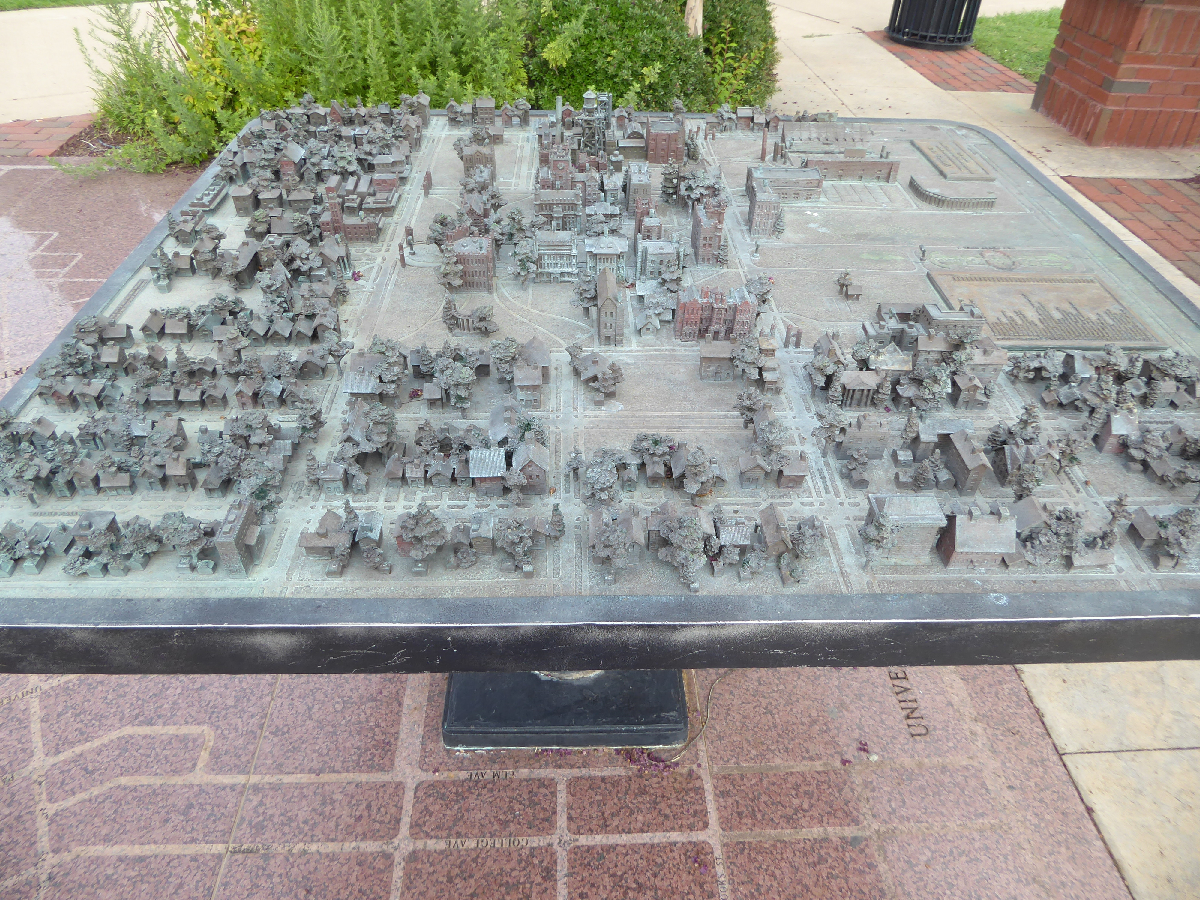 The display is a painstaking model of the university and its neighborhood about 1930. The view is from the west, looking over the university