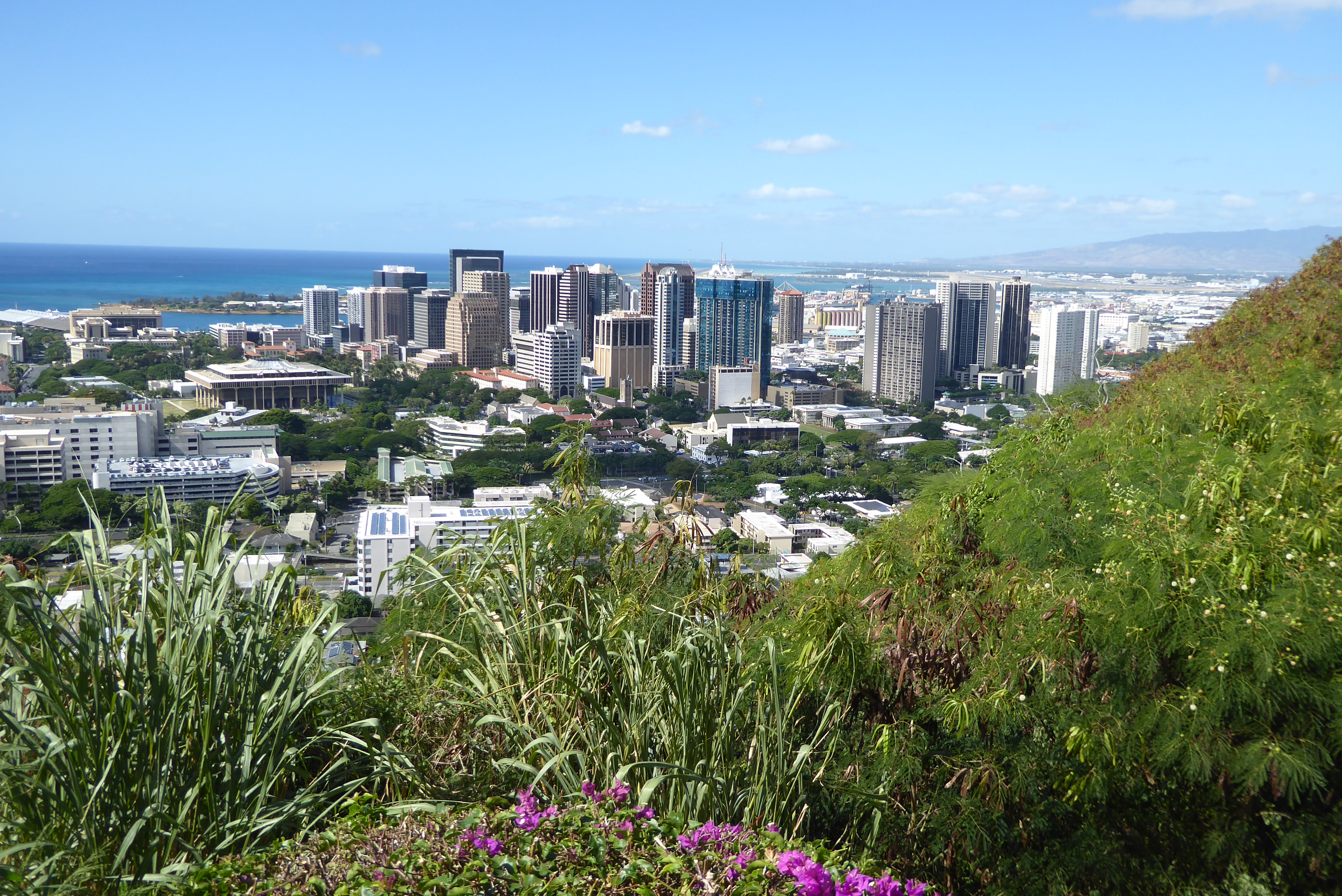 Back to the rim of the cone, this is the view west toward downtown and the harbor beyond, protected by Sand Island. The Honolulu airport is