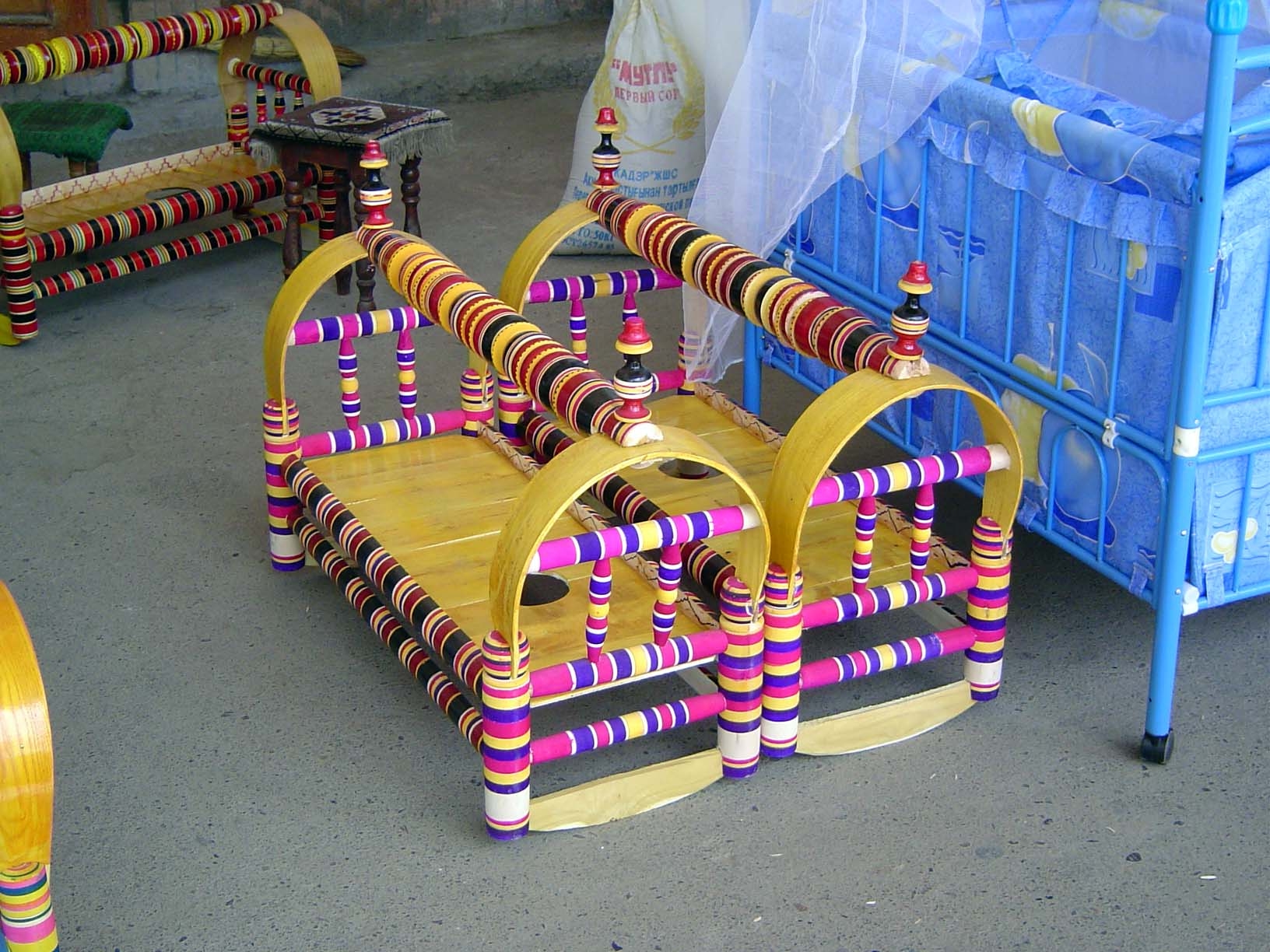 Among the items for sale are these cradles. The form is common from Turkey to China and has not changed in at least the last century. These