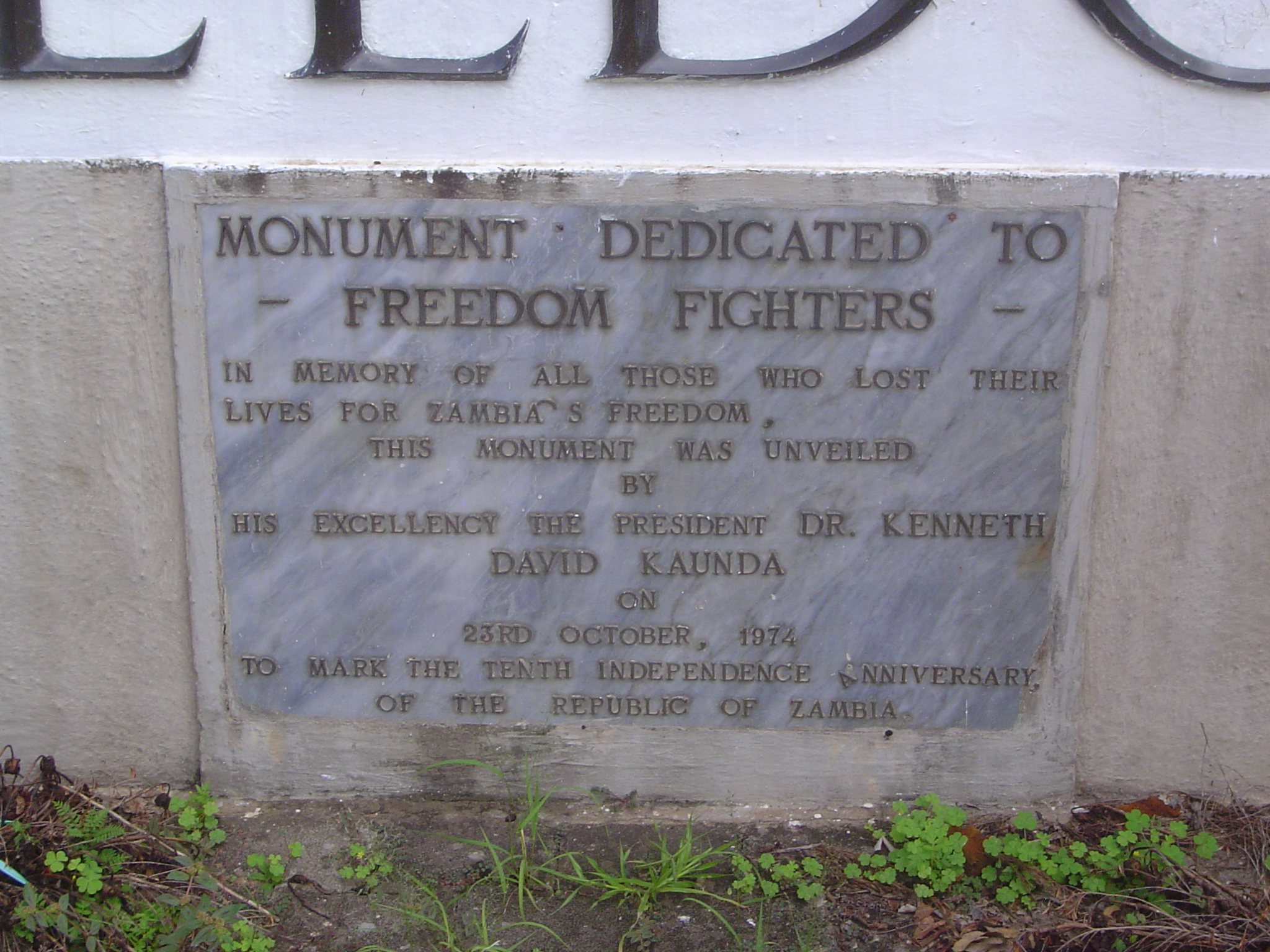 The plaque below the statue makes no mention of Mutembo.